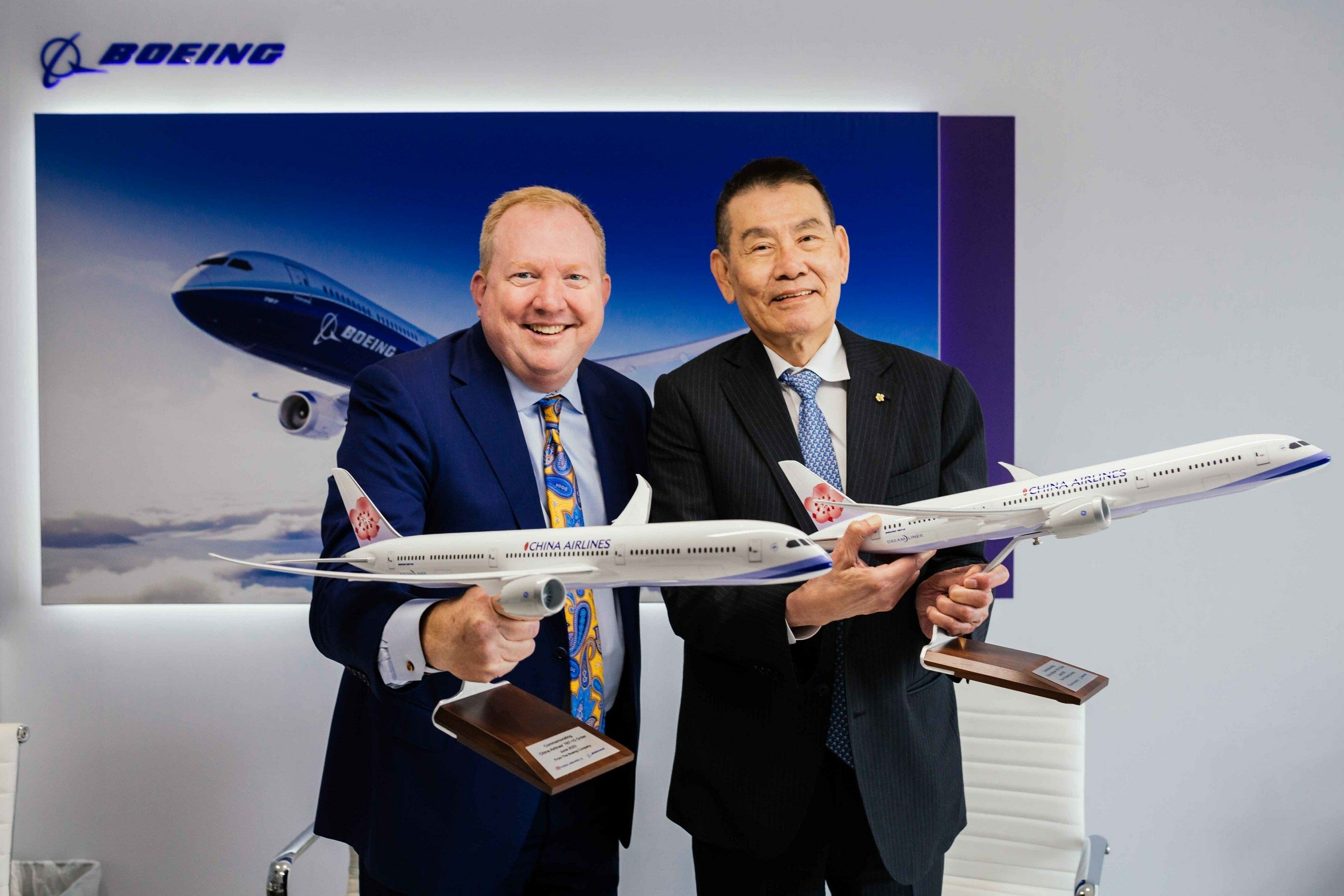 China Airlines and Boeing representatives show two Boeing 787 models with China Airlines' livery.