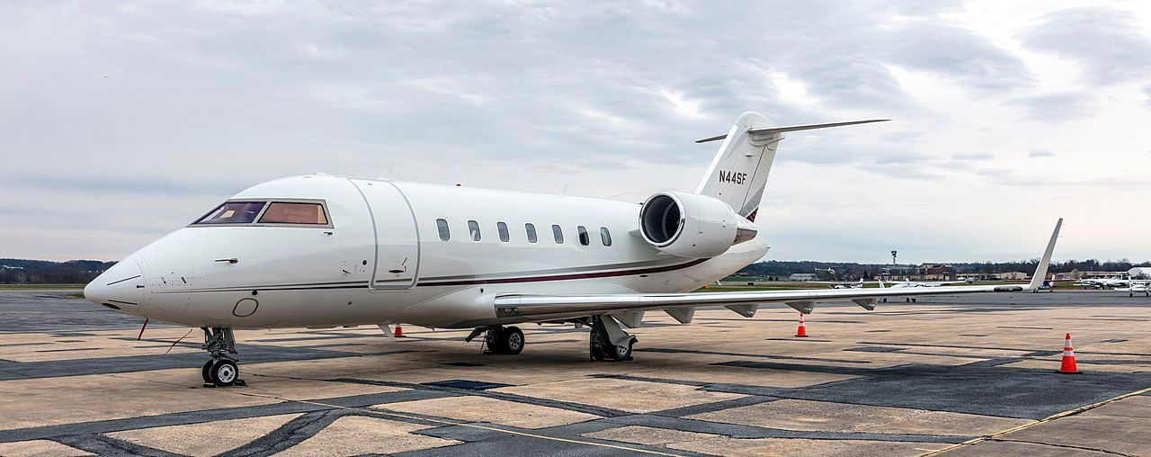 A Bombardier Challenger 600 series aircraft is parked at the airport.