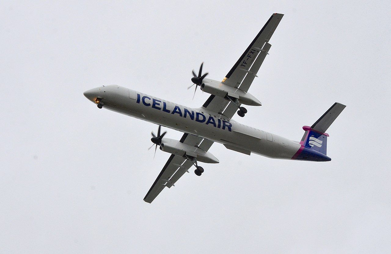 An Icelandair DHC-8 flying in the sky.