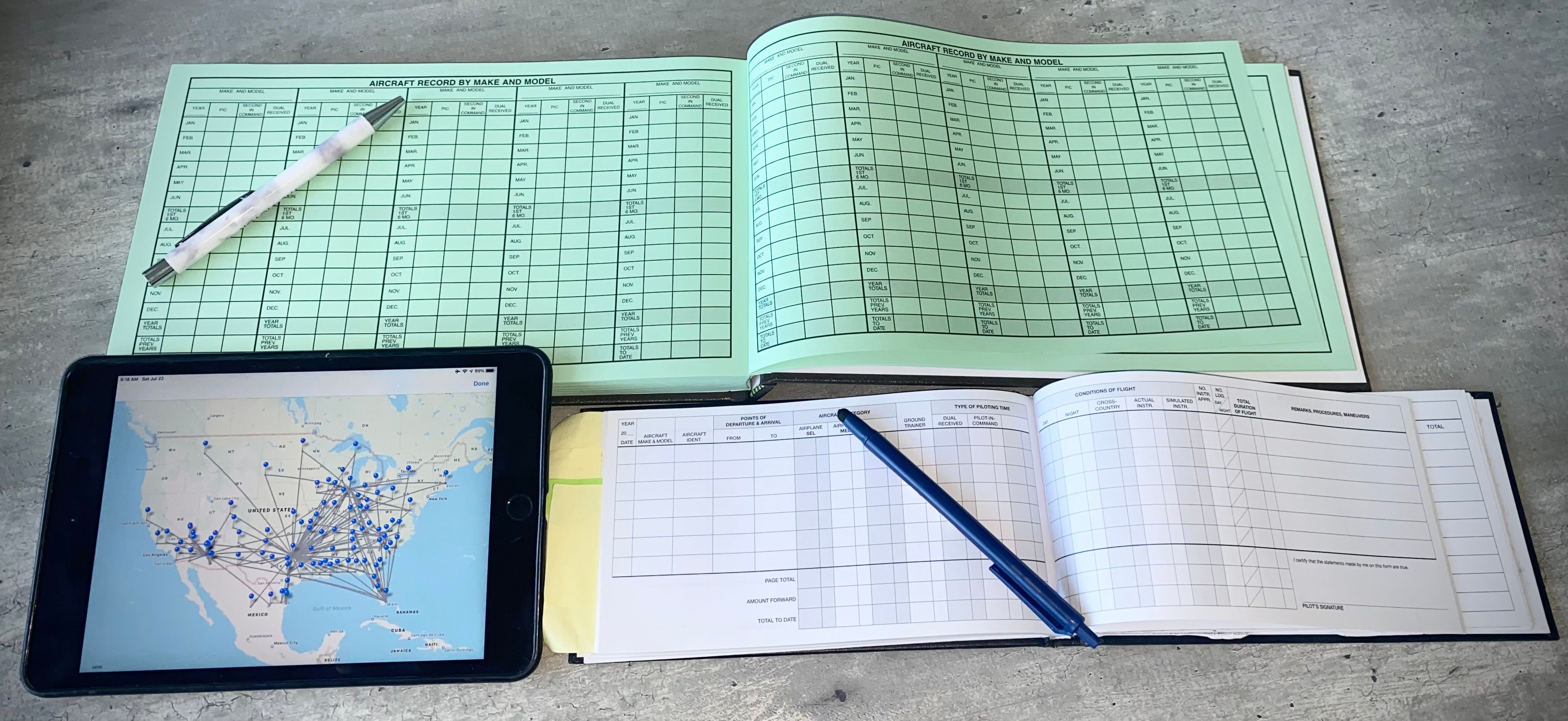 An assortment of digital and paper logbooks.