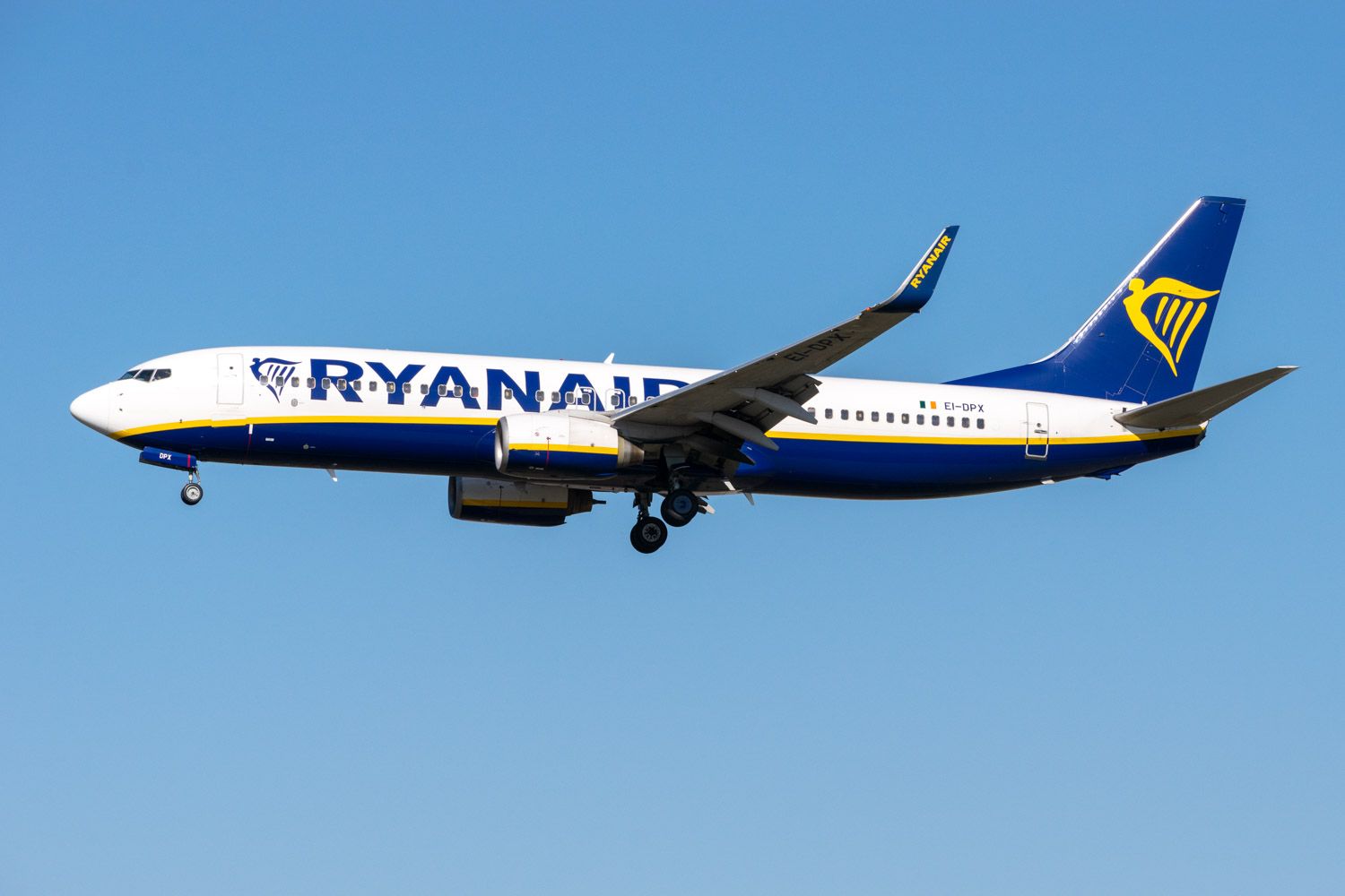 A Ryanair Boeing 737 flying in the sky.