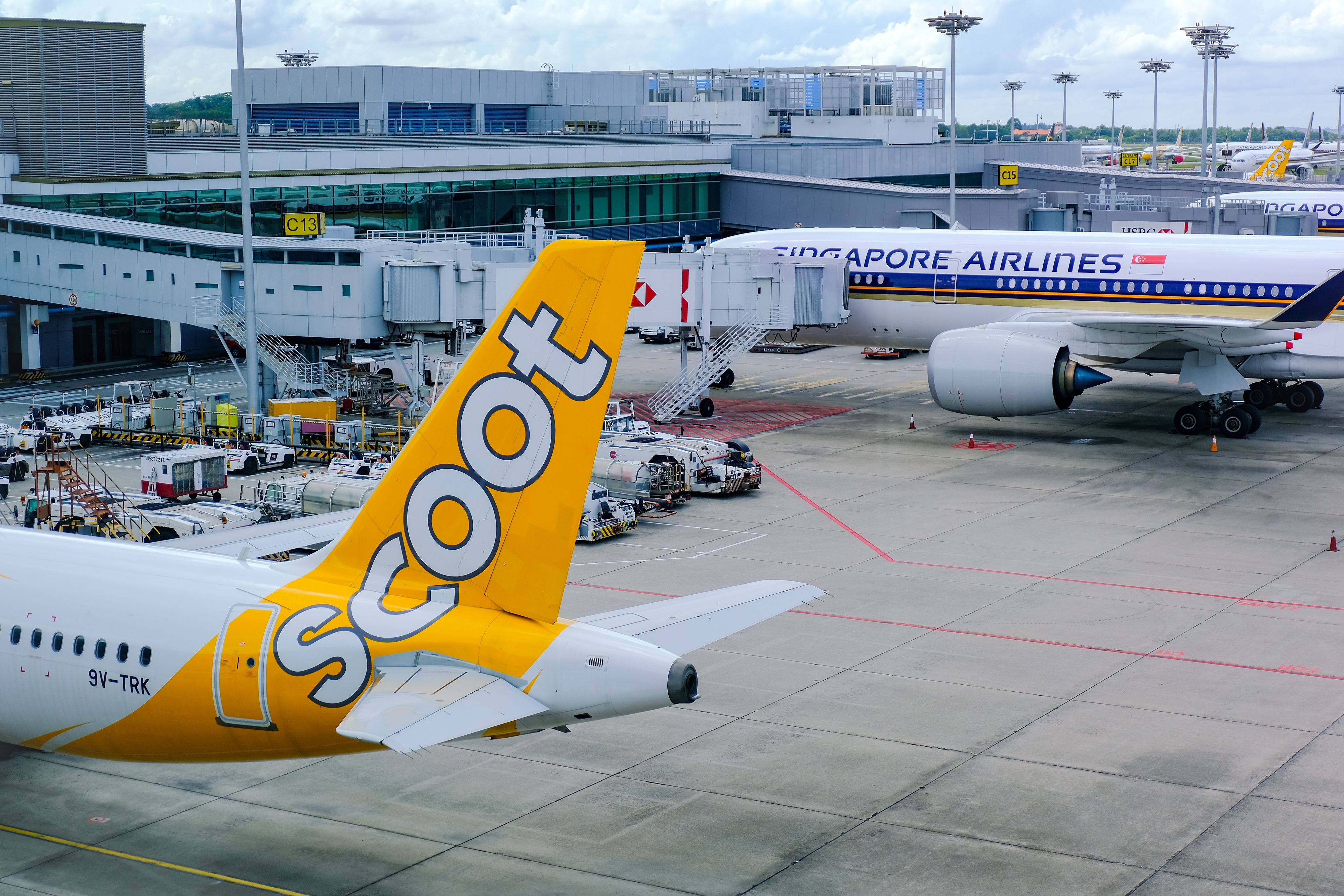 Scoot and Singapore Airlines planes parked at Changi Airport 