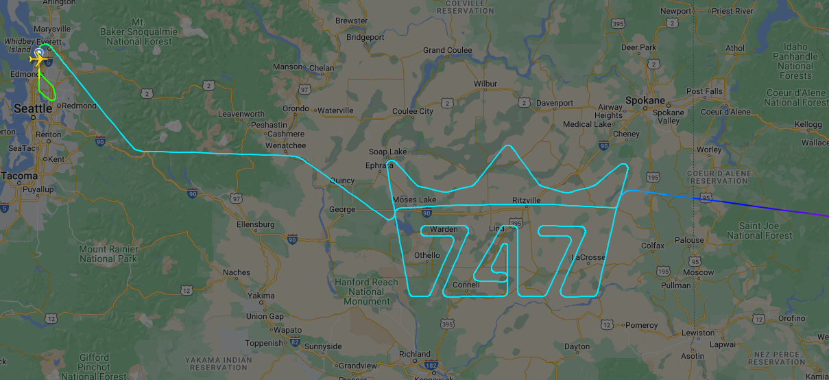 A flight tracker map showing the numbers 747 with a crown being drawn by an Atlas Air Boeing 747.