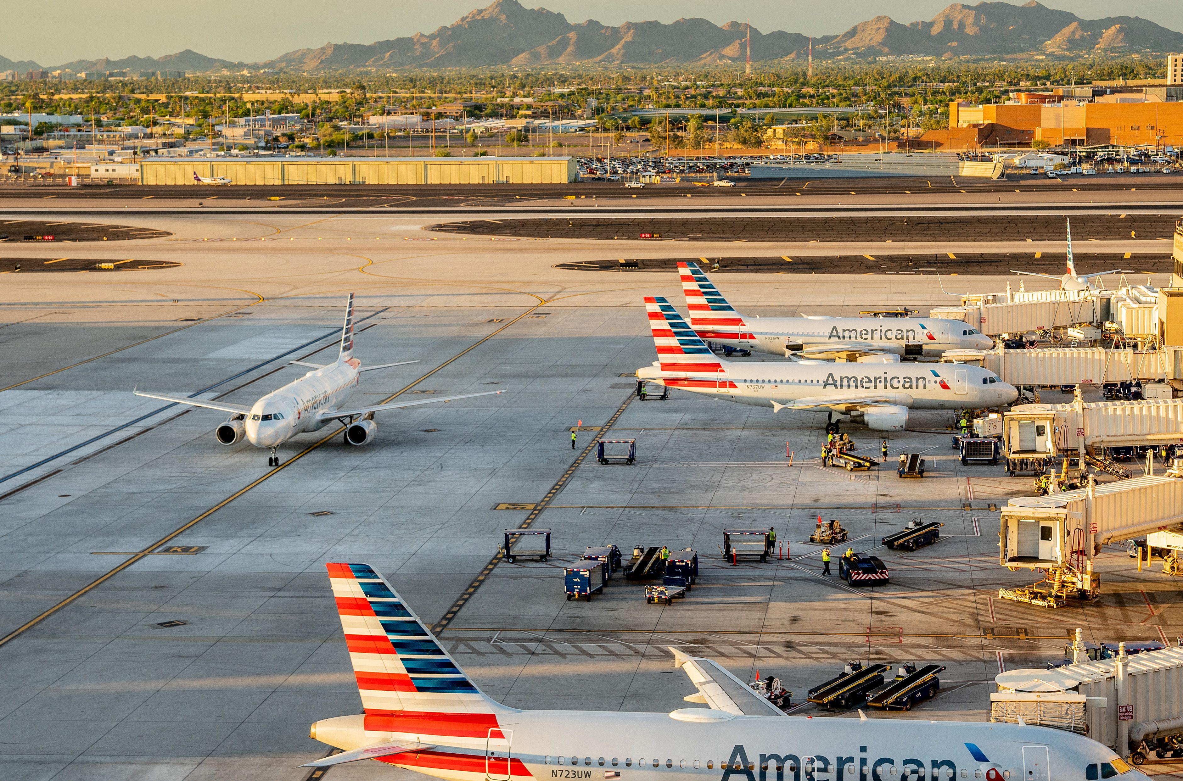 Many American Airlines aircraft lined up at Phoenix Sky Harbor International Airport.