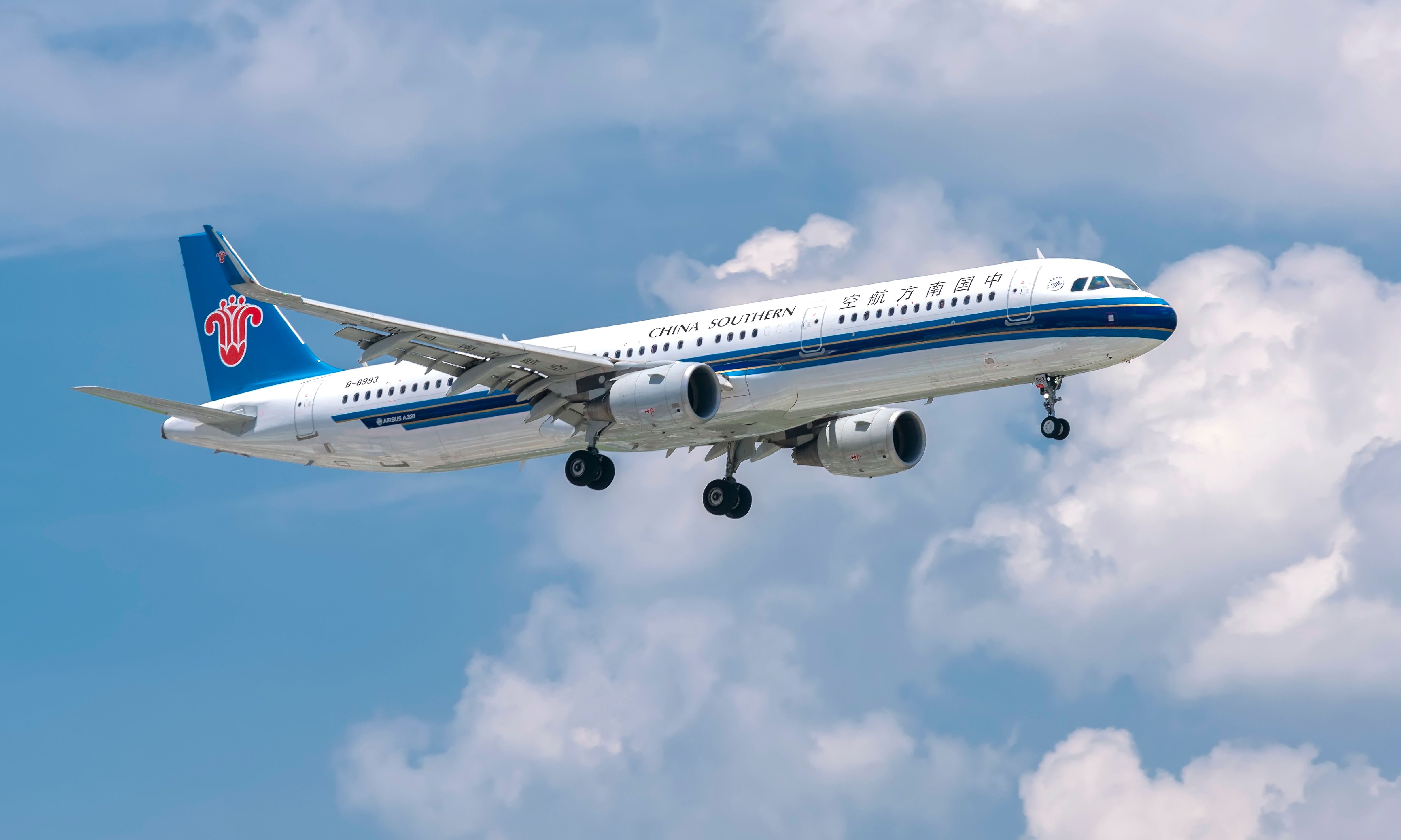 shutterstock_1415429741 - Ho Chi Minh City, Vietnam - June 1st, 2019: Aircraft airbus A321 of China Southern Airlines flying through clouds sky prepare landing at Tan Son Nhat International Airport, Ho Chi Minh City, Vietnam