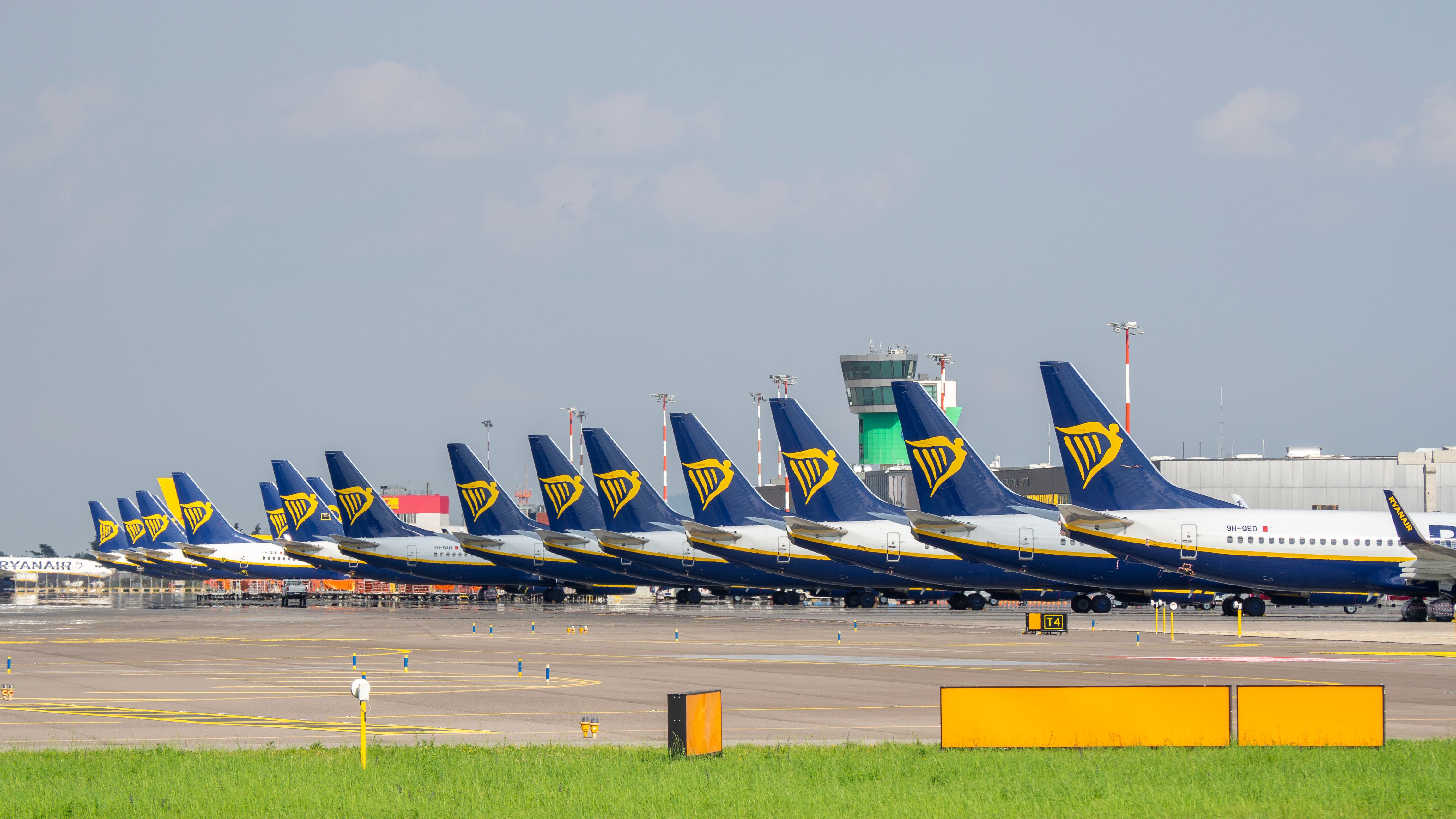 Over a dozen Ryanair aircraft tails at Bergamo Airport in Italy.