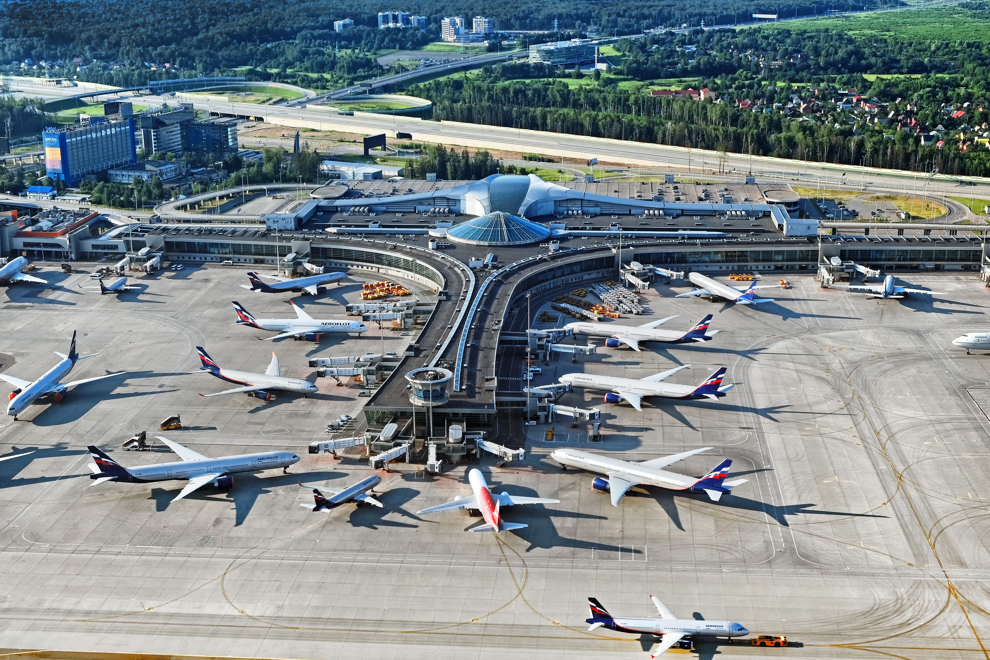 Aerial top view of Sheremetyevo airport terminal D building with Aeroflot Airbus Boeing passenger airplanes