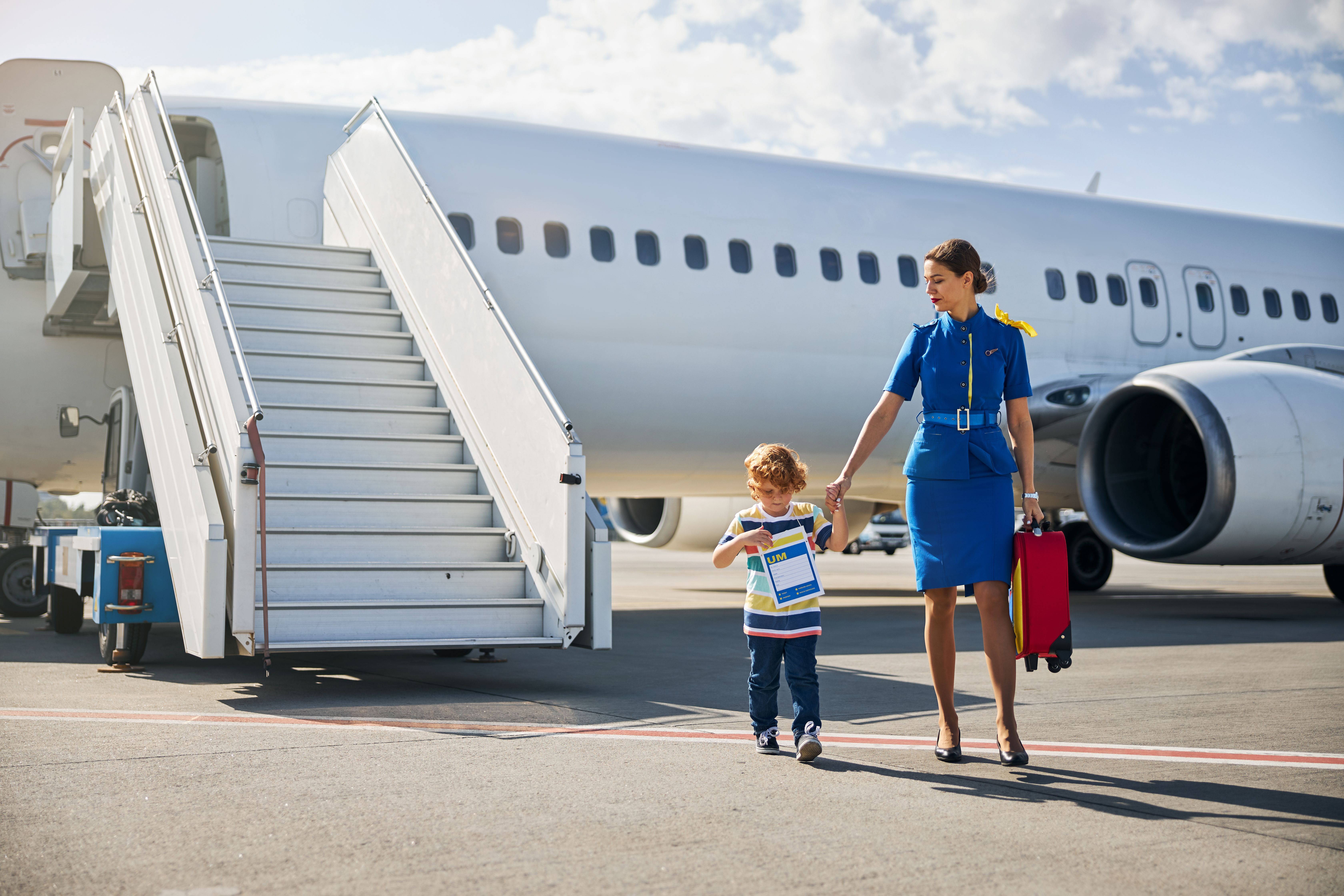 Unaccompanied minor with a flight attendant