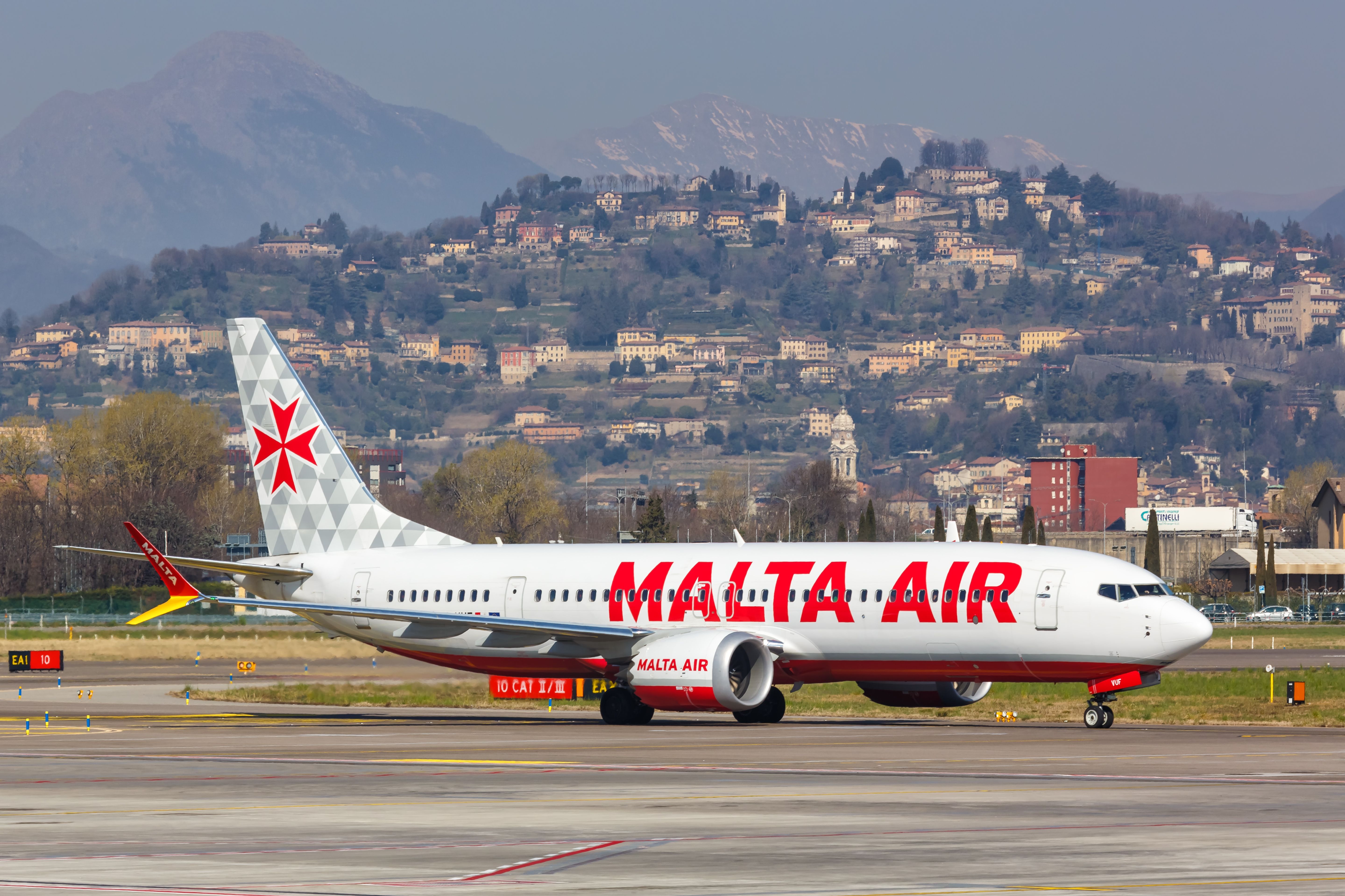 A Malta Air Boeing 737 MAX taxiing to the gate.