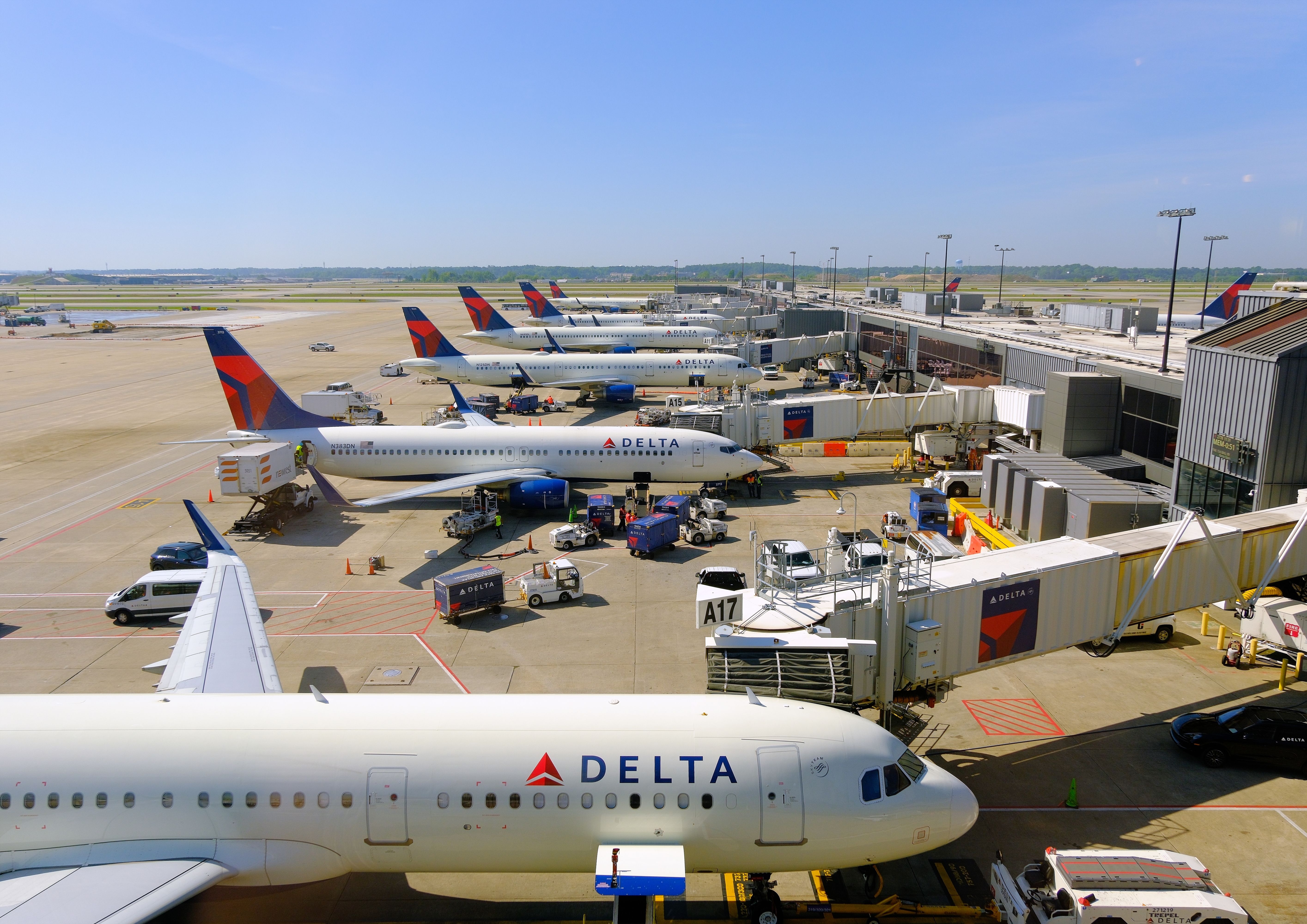 Many Delta Air Lines Aircraft Lined Up At Gates In Atlanta.