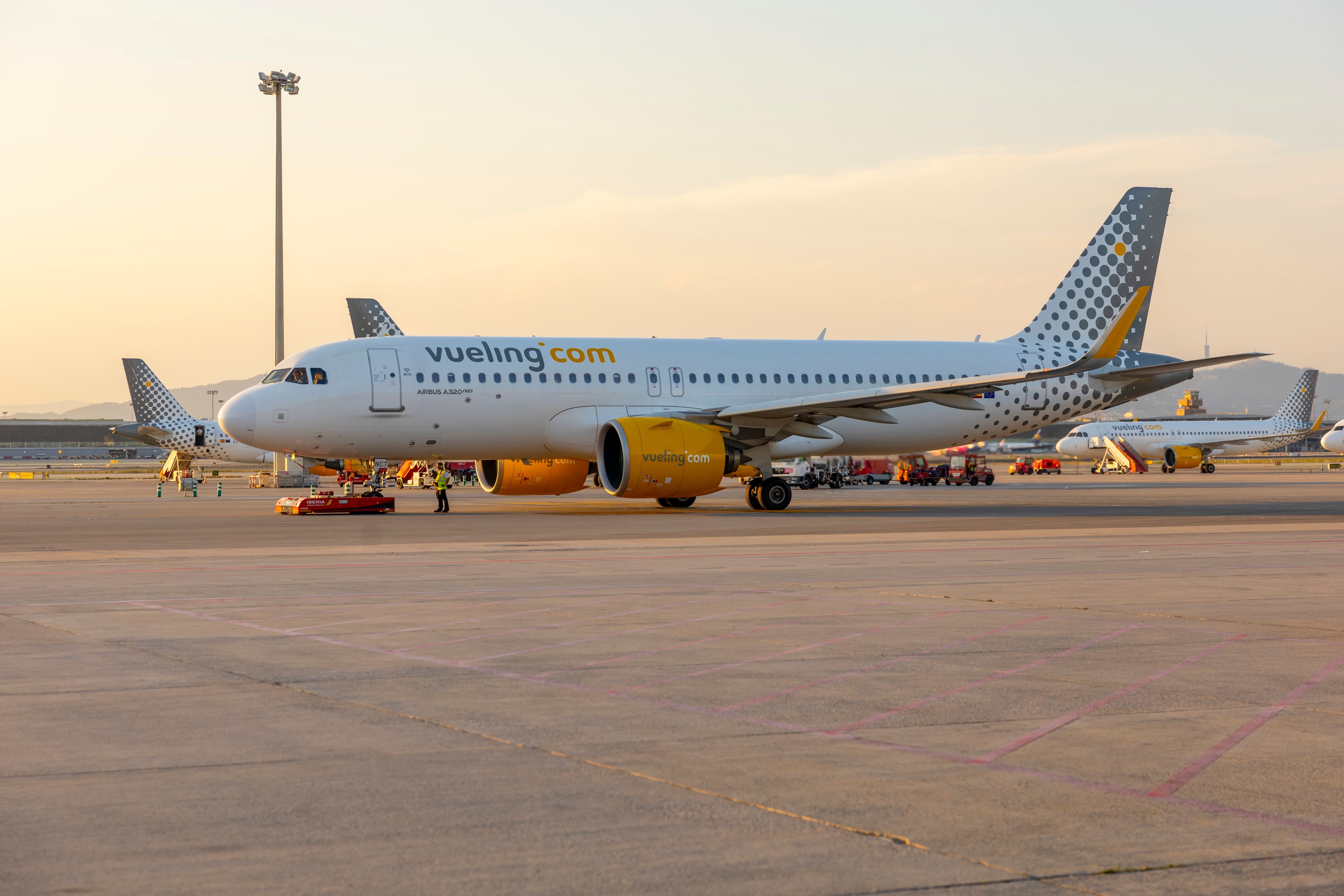 A Vueling Airlines Airbus A320 neo being pushed back.