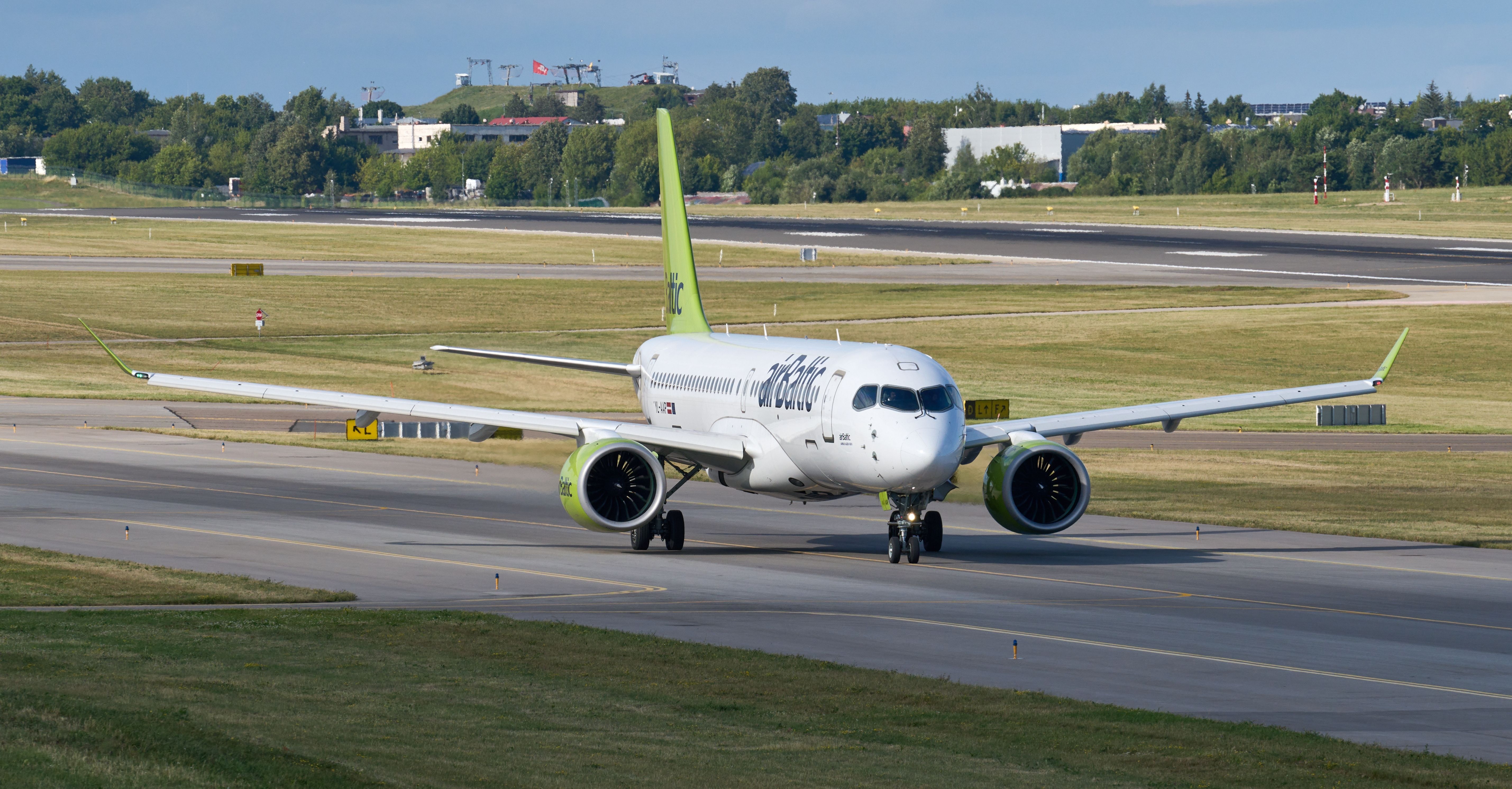 airBaltic Airbus A220 Taxiing In Vilnius