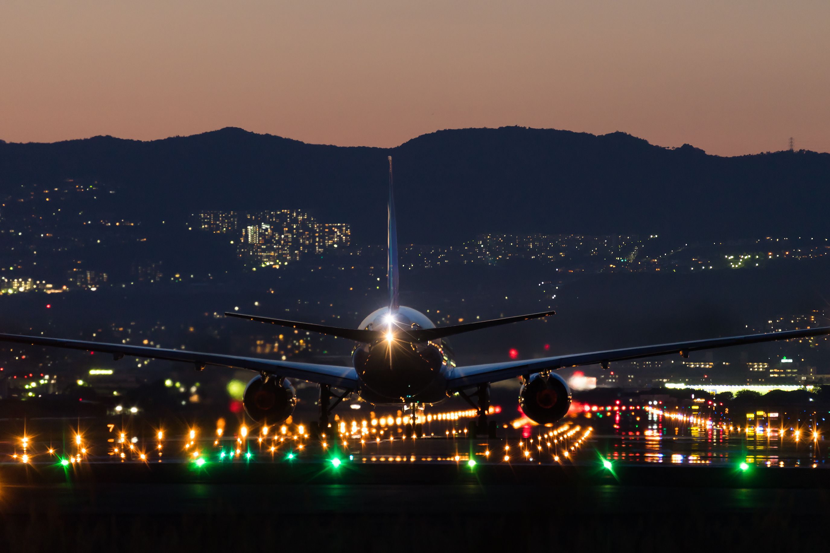 An aircraft landing at night.