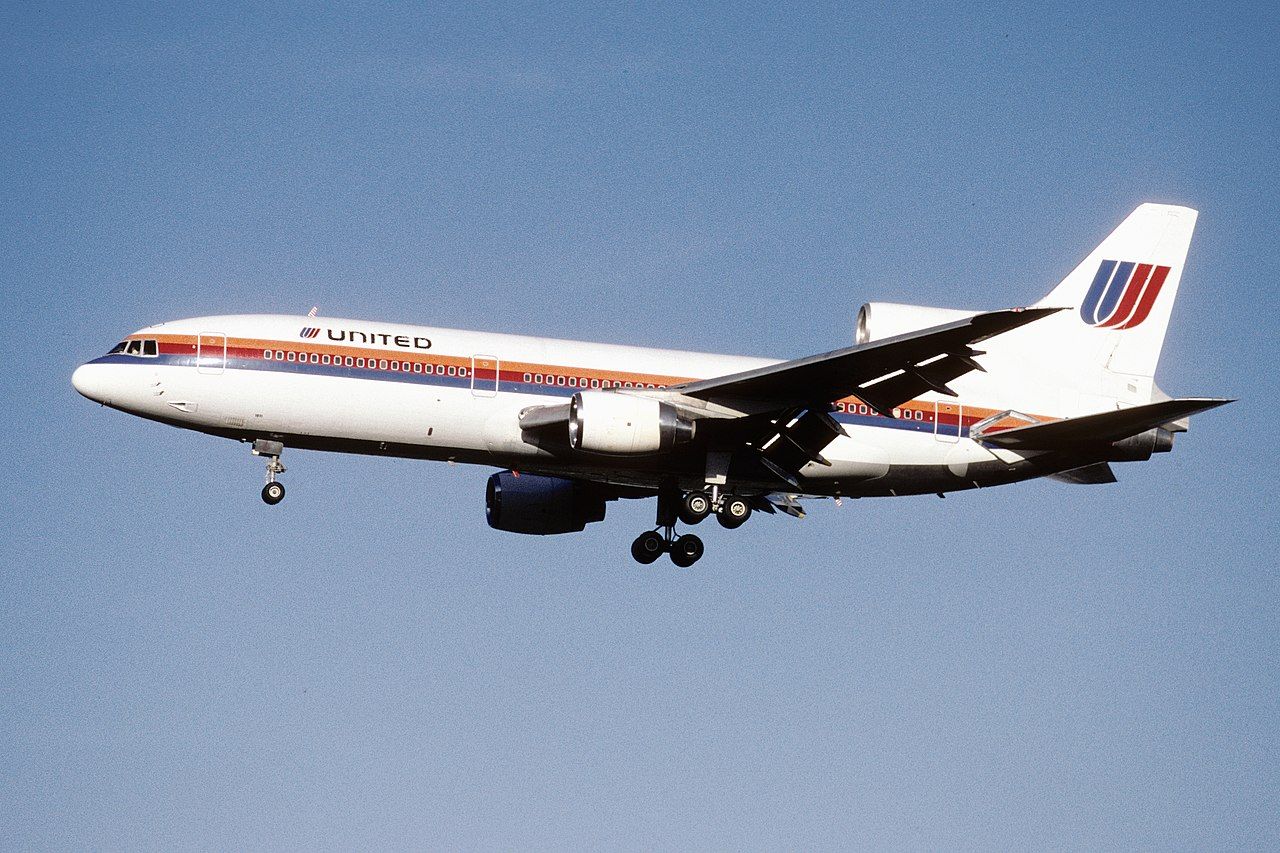 A United Airlines Lockheed L-1011 TriStar flying in the sky.