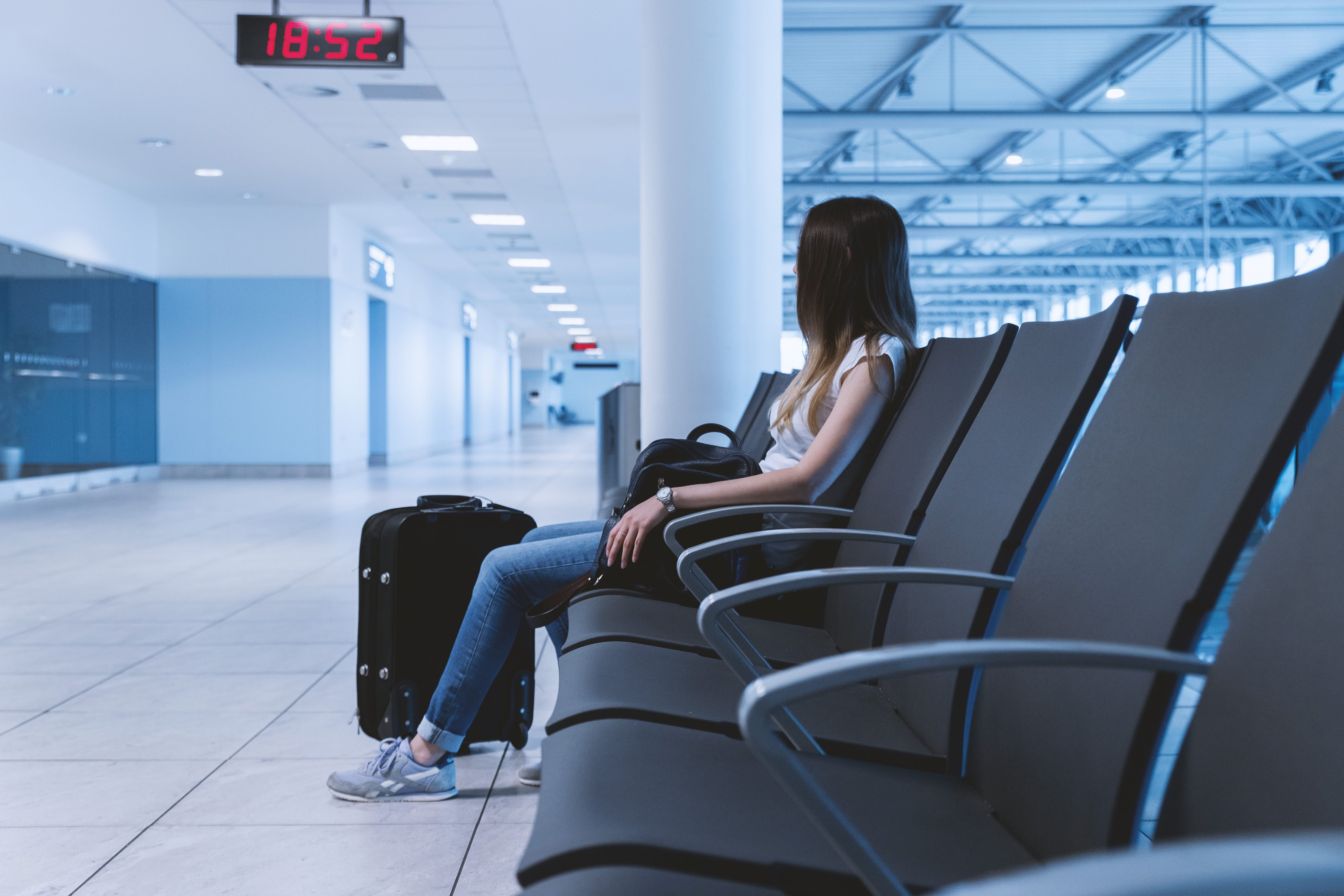 Woman sitting at airport waiting lounge