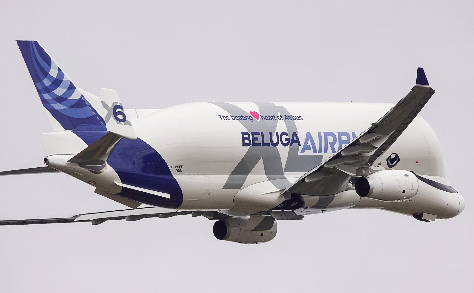 An Airbus BelugaXL flying in the sky.