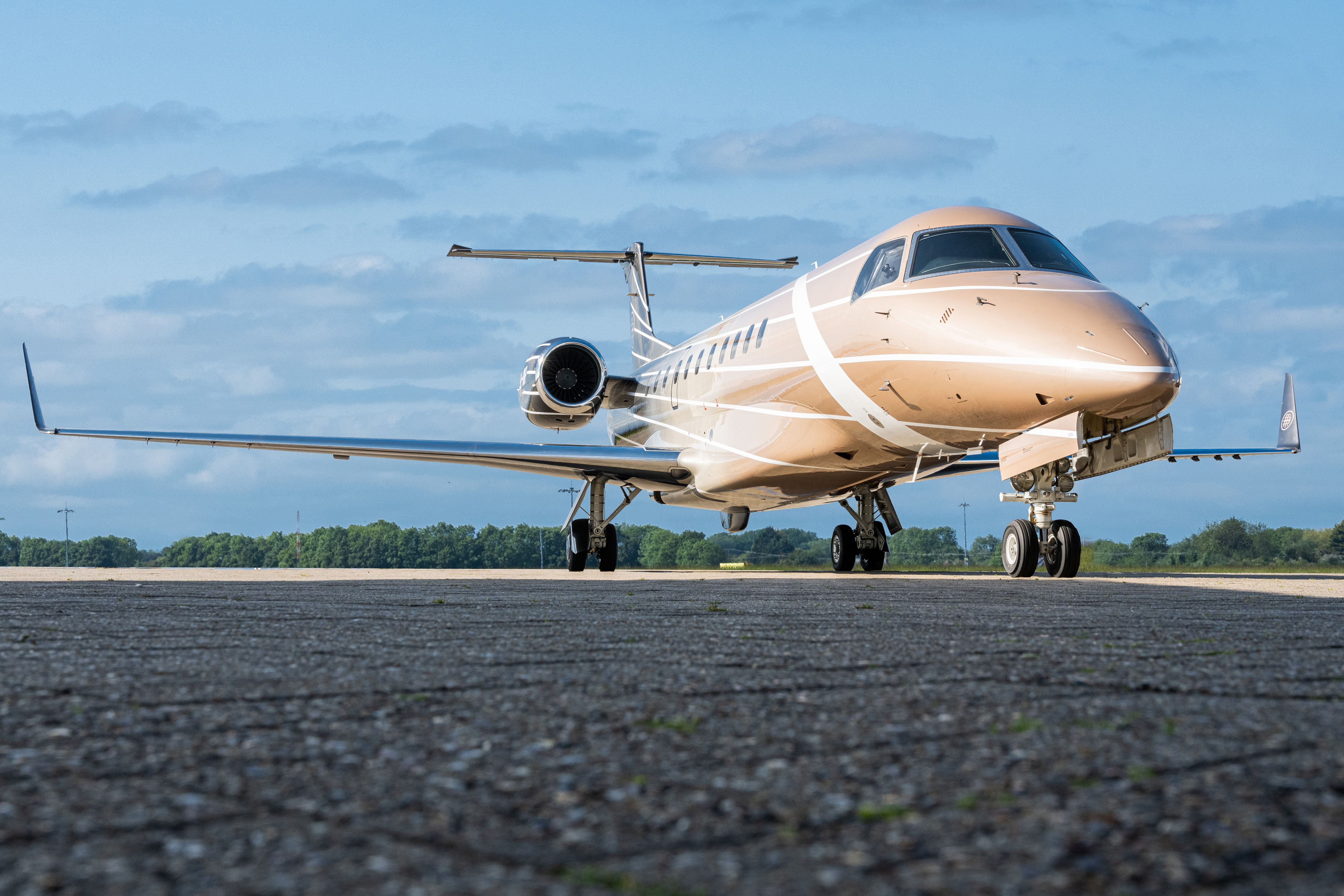 AirX's Embraer Legacy 600 taxiing at an airfield.