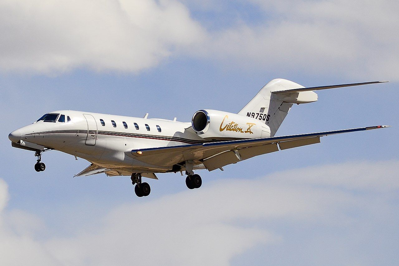 A Cessna Citation X flying in the sky.
