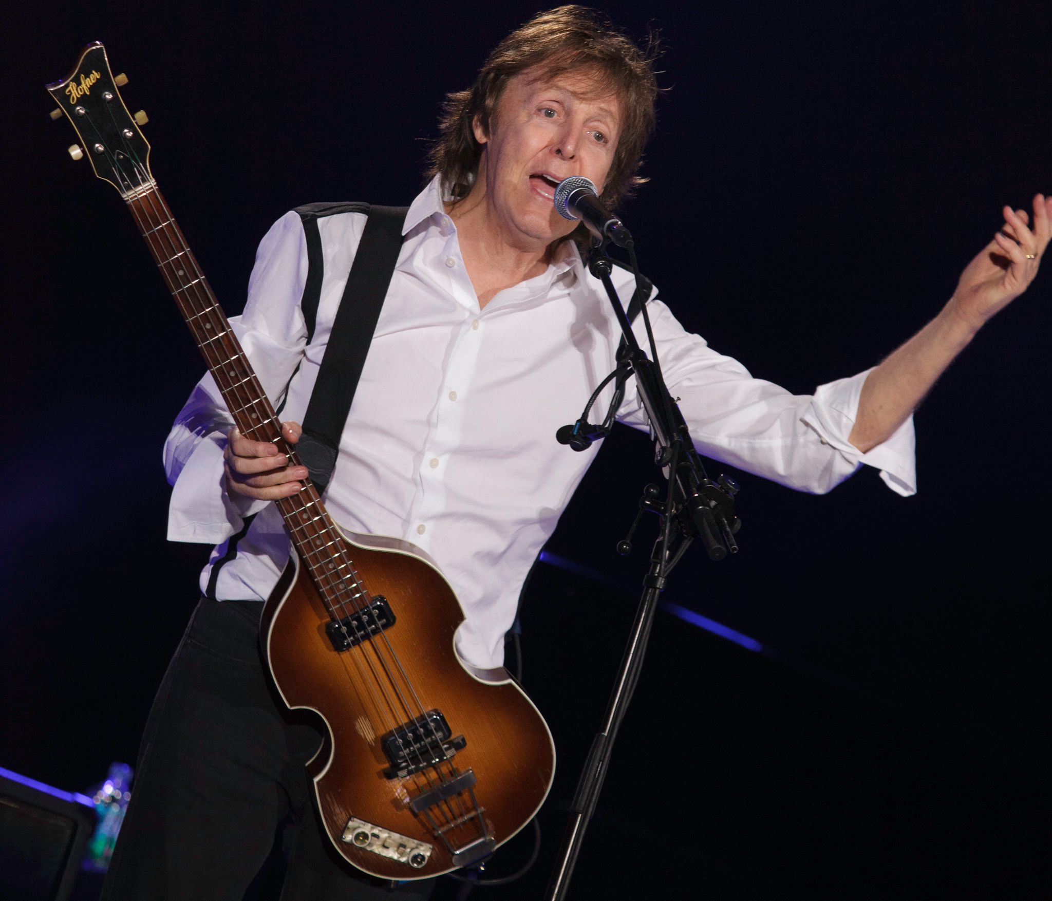 A Photo of Paul McCartney with his guitar.