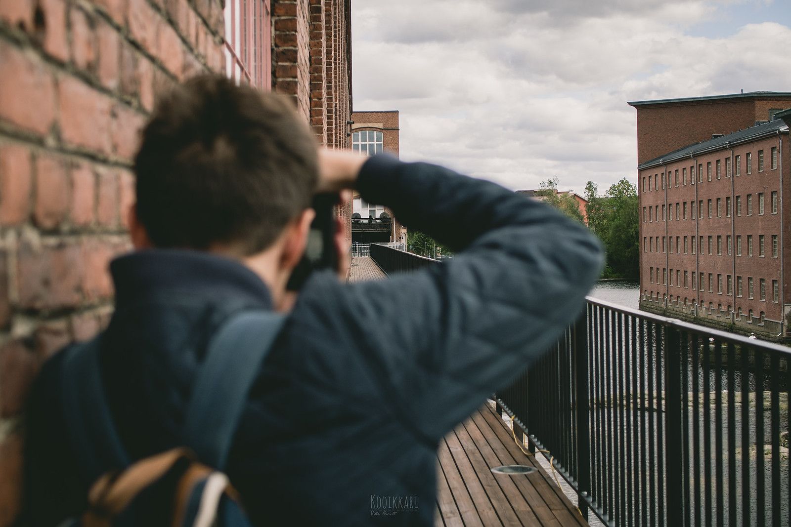 A person taking a photo with a camera.