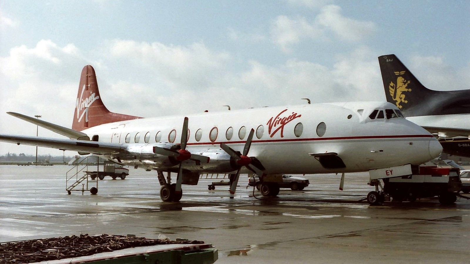 A Virgin Atlantic Vickers Viscount parked at an airport.