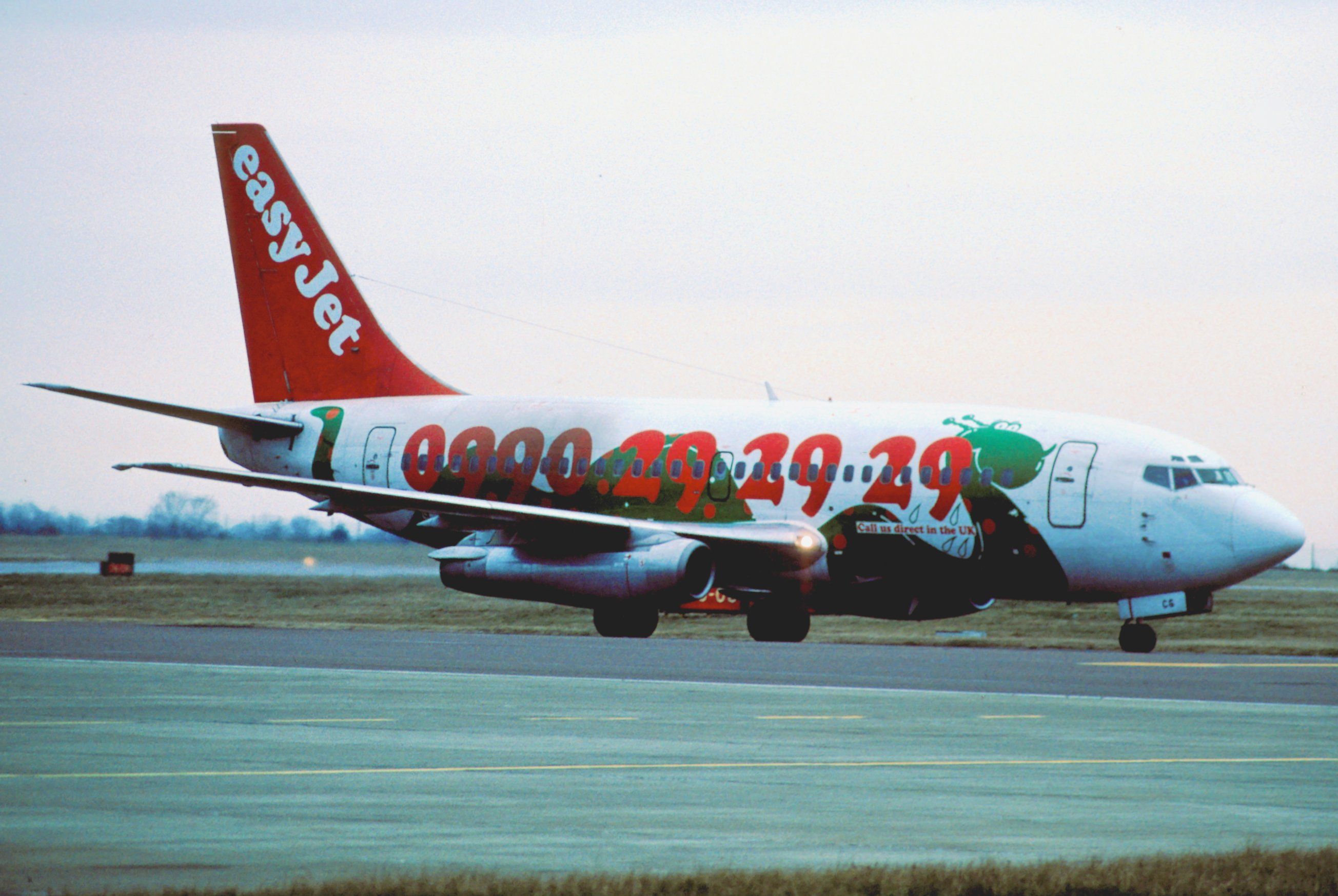 An old easyJet aircraft taxiing to the runway.
