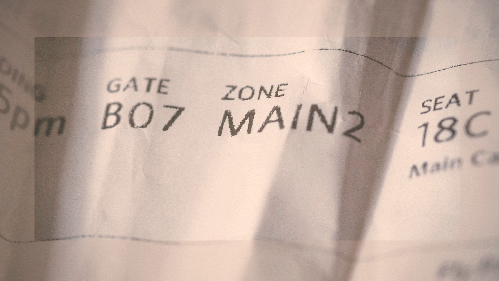 A closeup of an airline Boarding Pass.