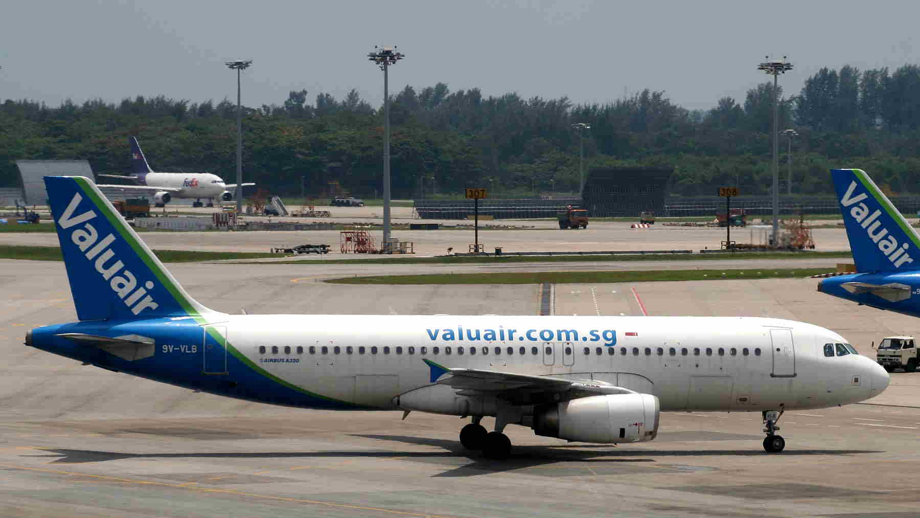 A Valuair Airbus A320 Taxiing To The Gate.