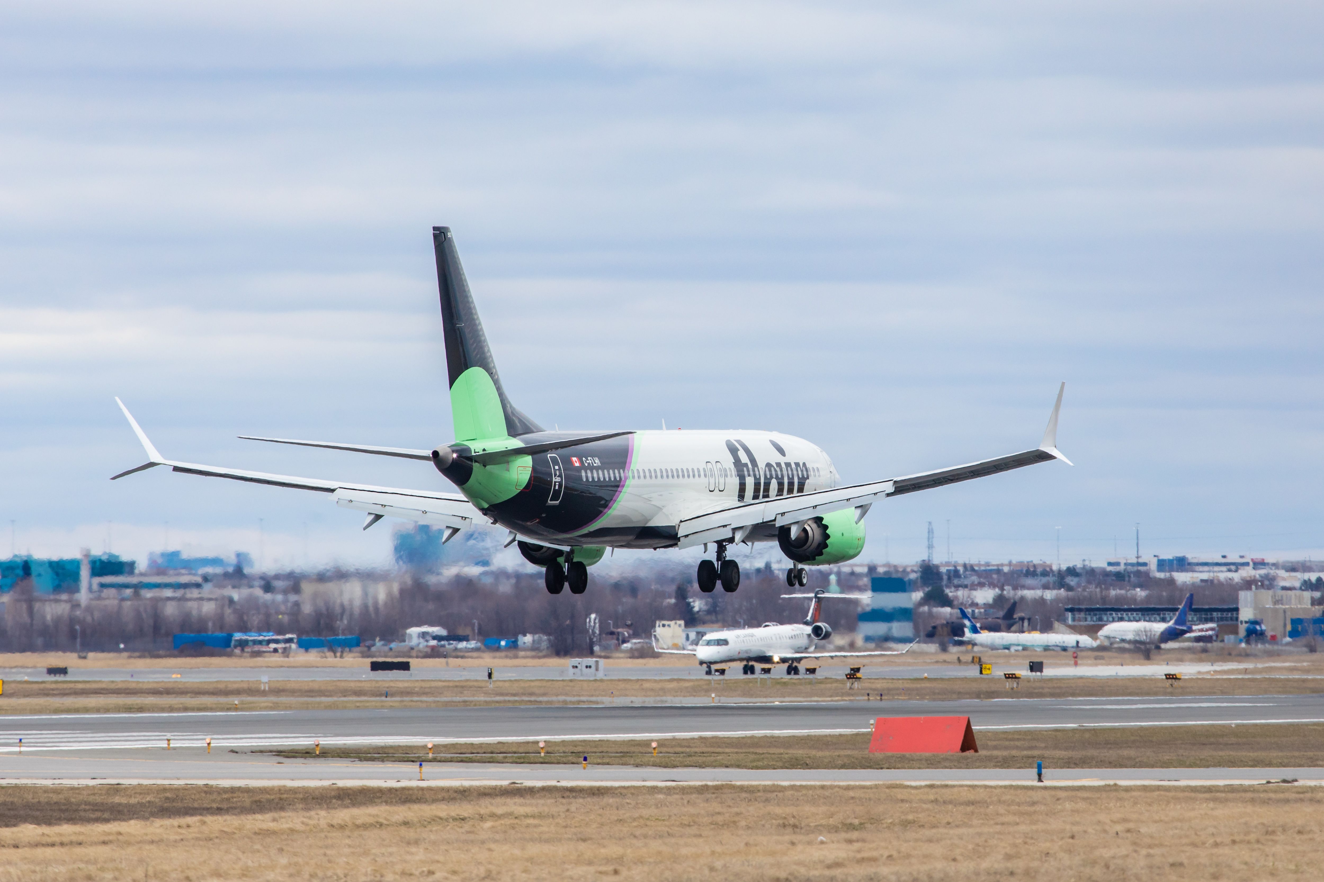 A Flair Airlines Boeing 737 MAX 8 landing at Pearson Toronto Airport.