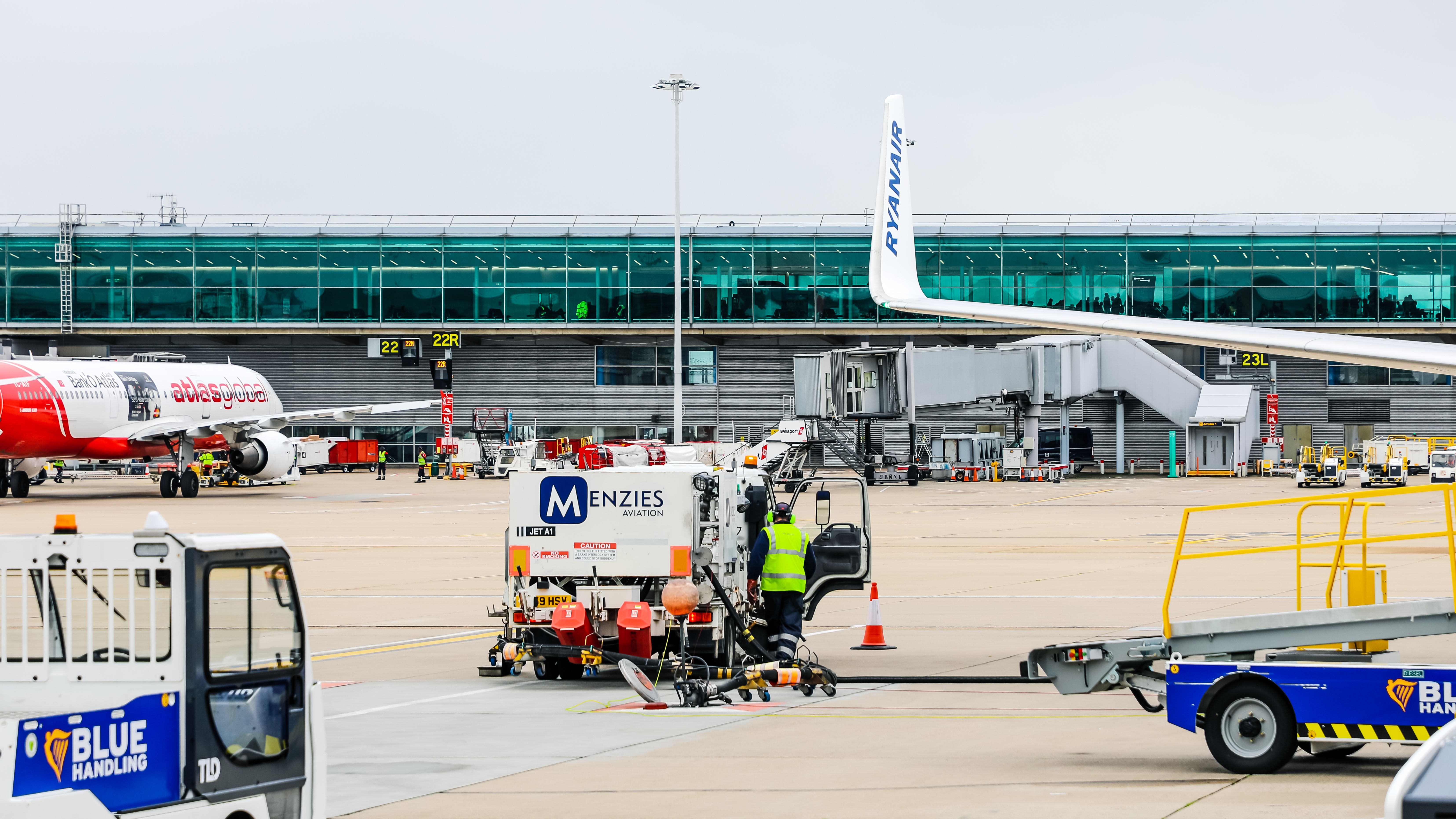 A Menzies Aviation ground service car