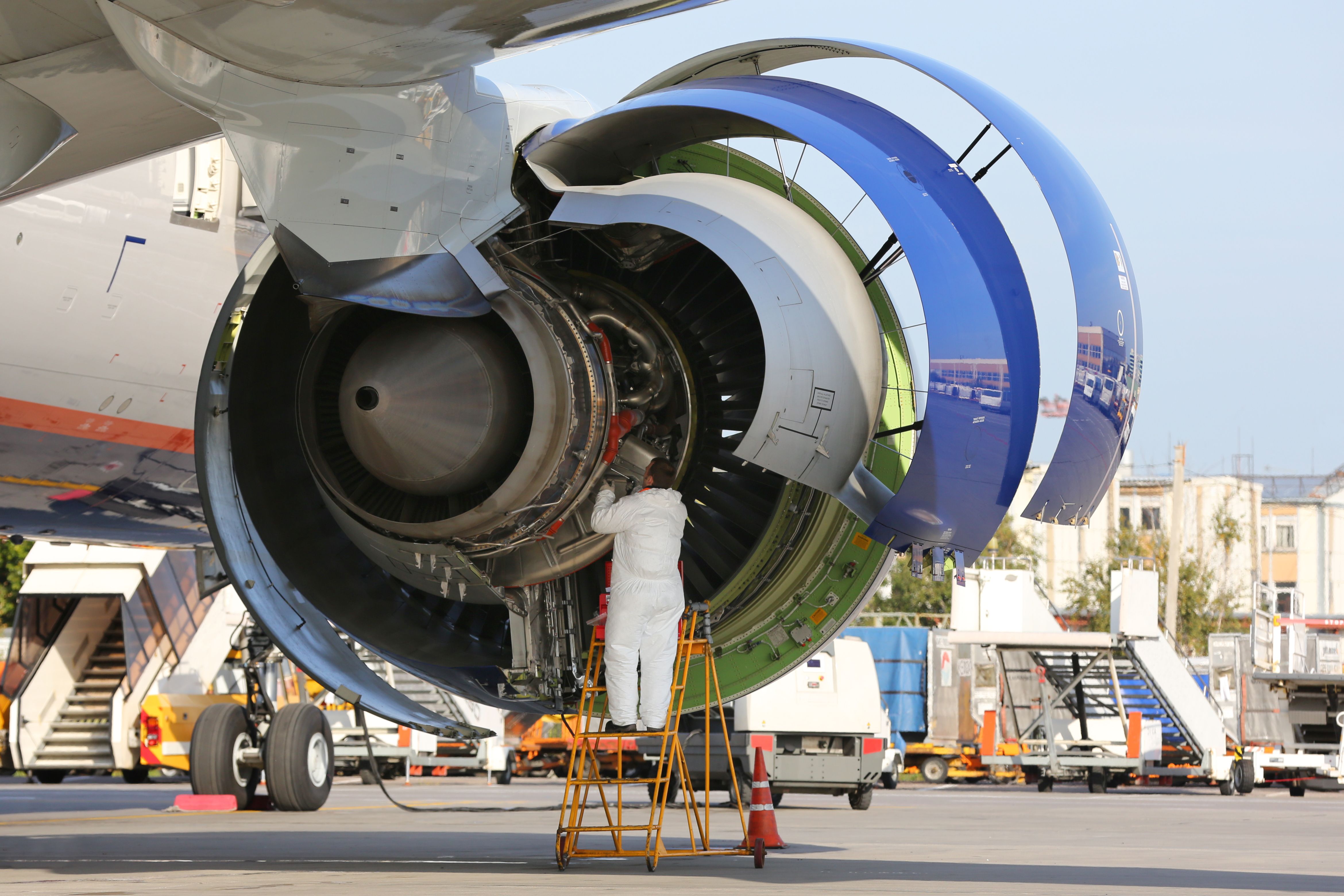 An engine being checked by an engineer.