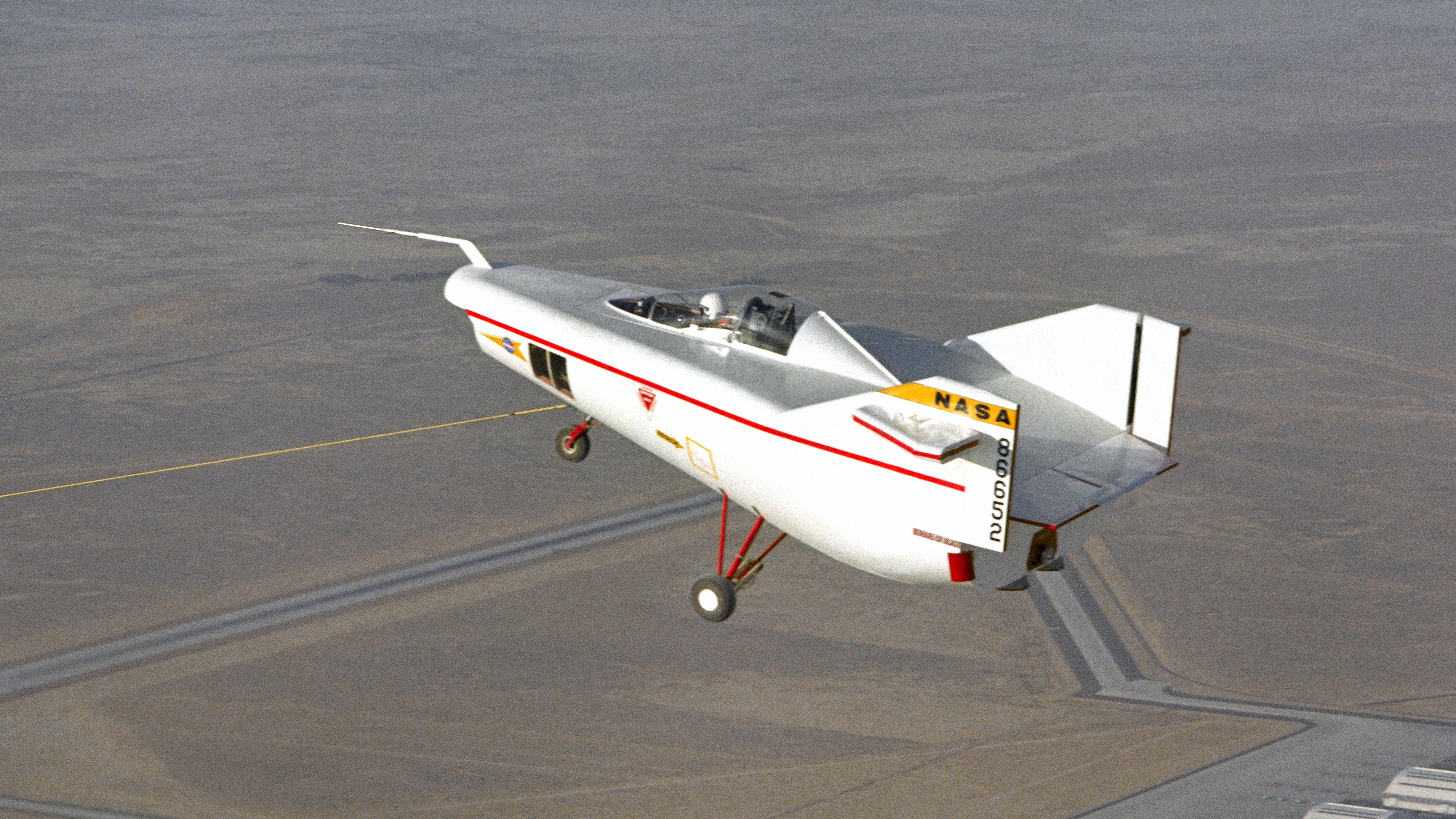 A NASA M2-F1 flying in the sky.
