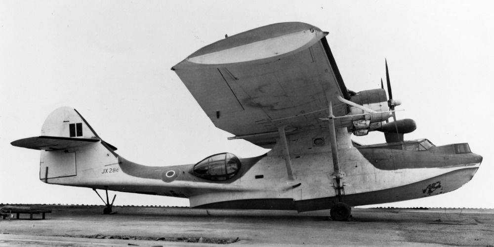 A Consolidated PBY Catalina parked in a field.