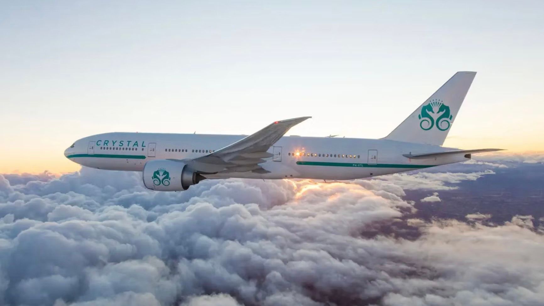 A Crystal Air Cruises Boeing 777 flying above the clouds.