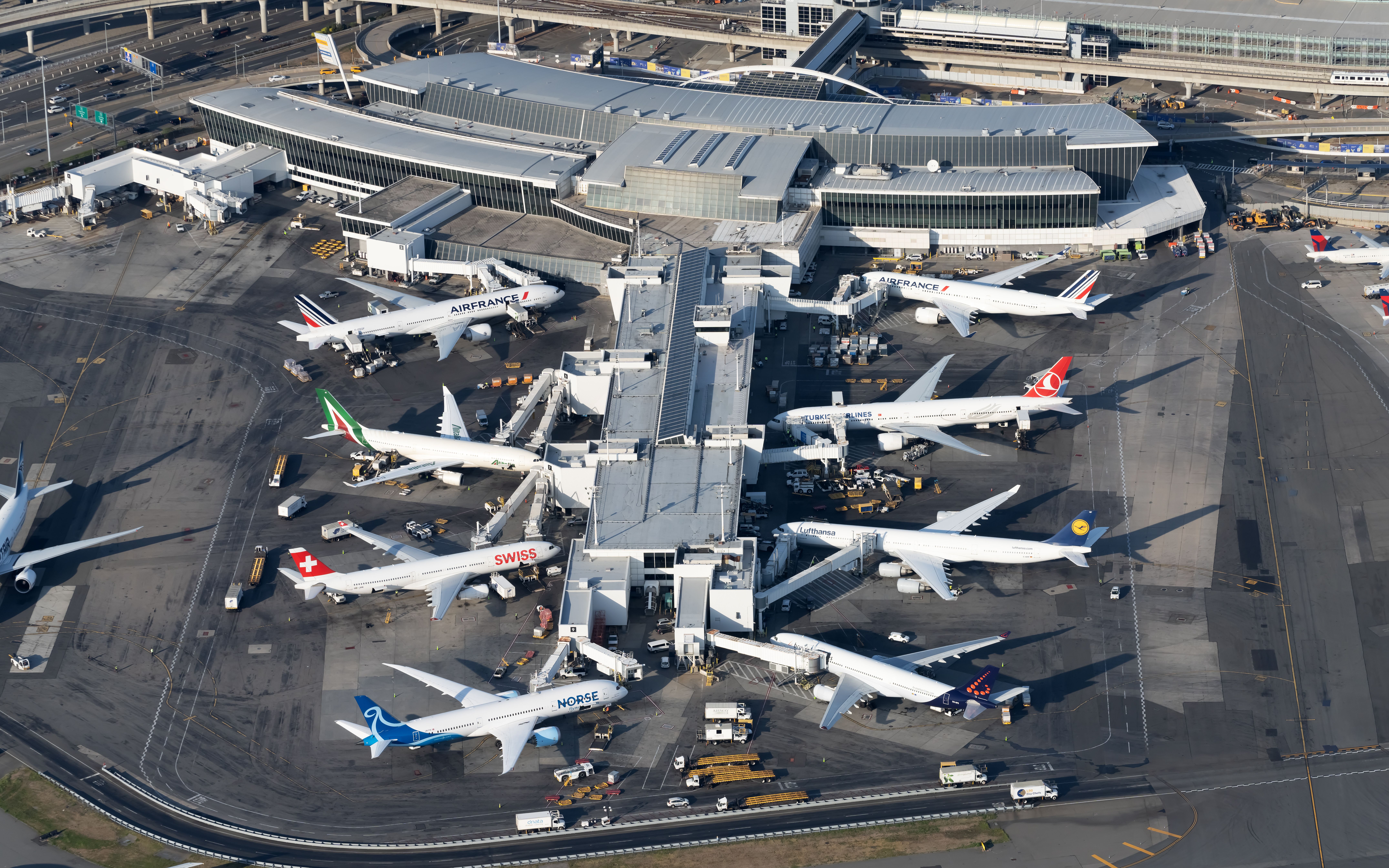 Many planes from around the world at JFK.