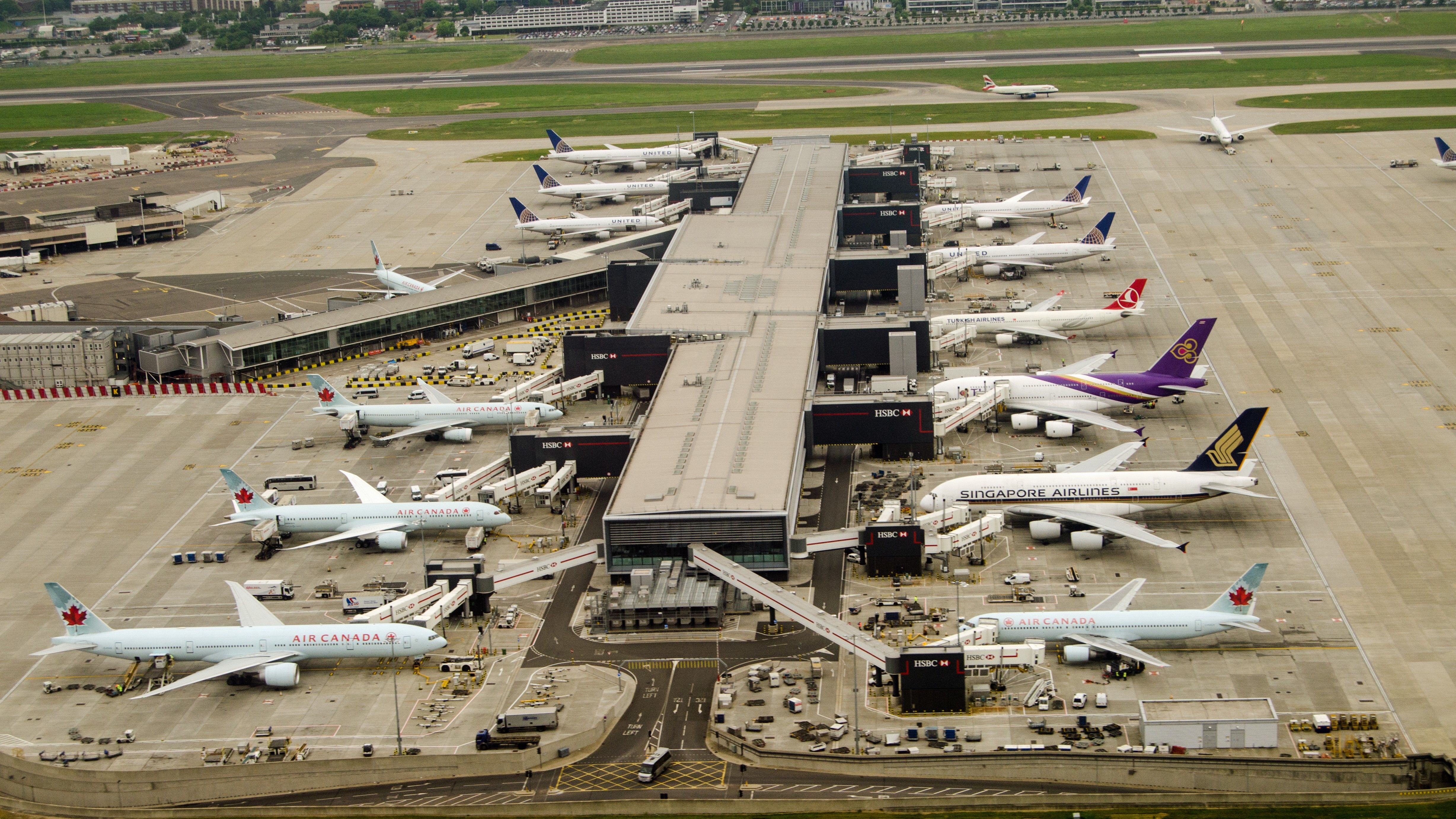 Many different Aircraft parked at London Heathrow terminal 2.