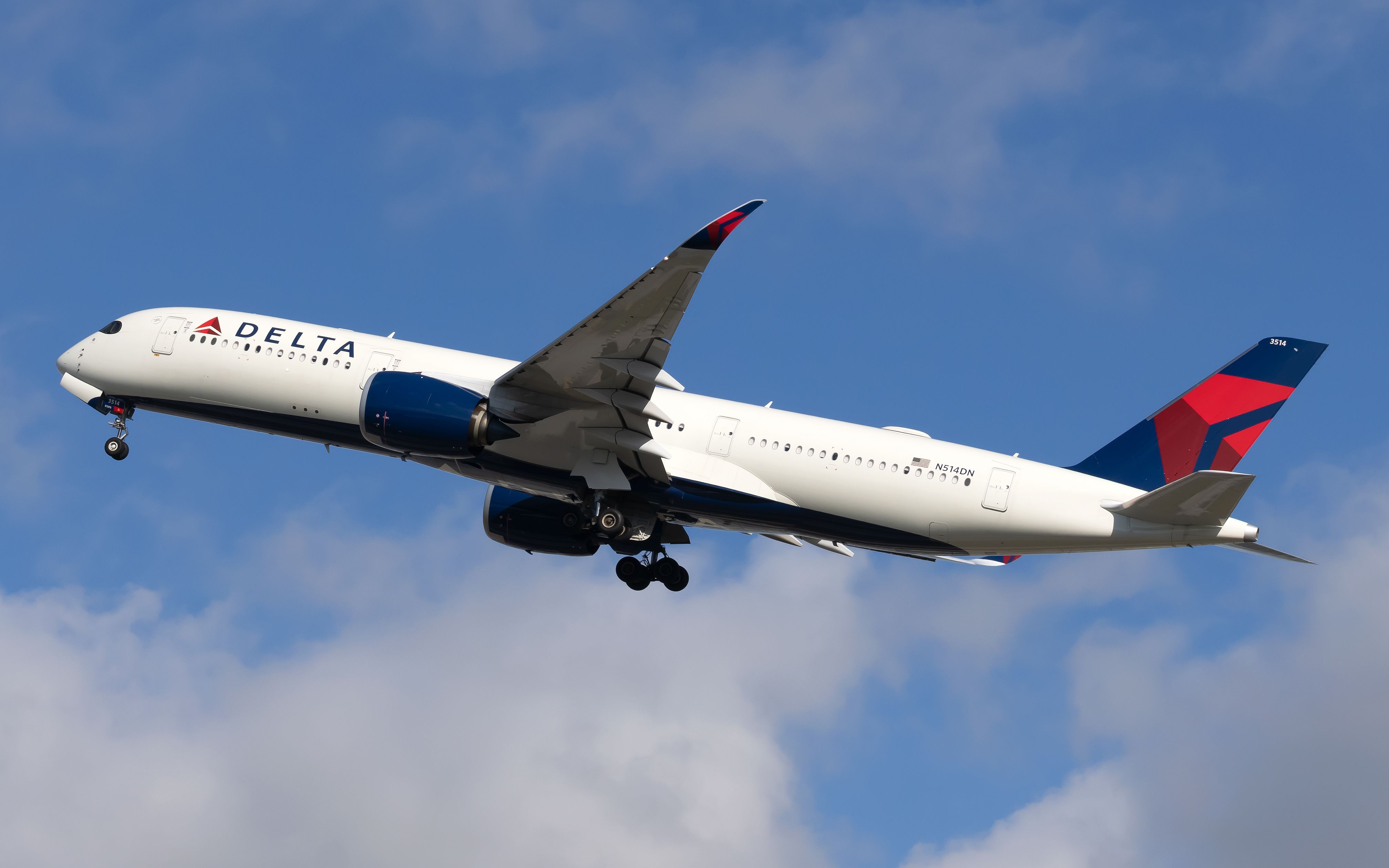A Delta Air Lines Airbus A350-941 flying in the sky.