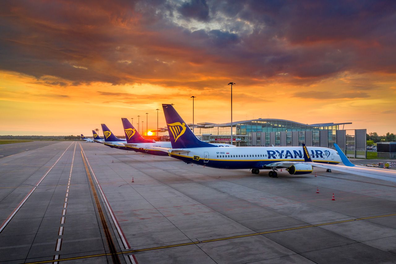 A Photo of muiltiple Ryanair Boeing 737s pakred during Sunset.
