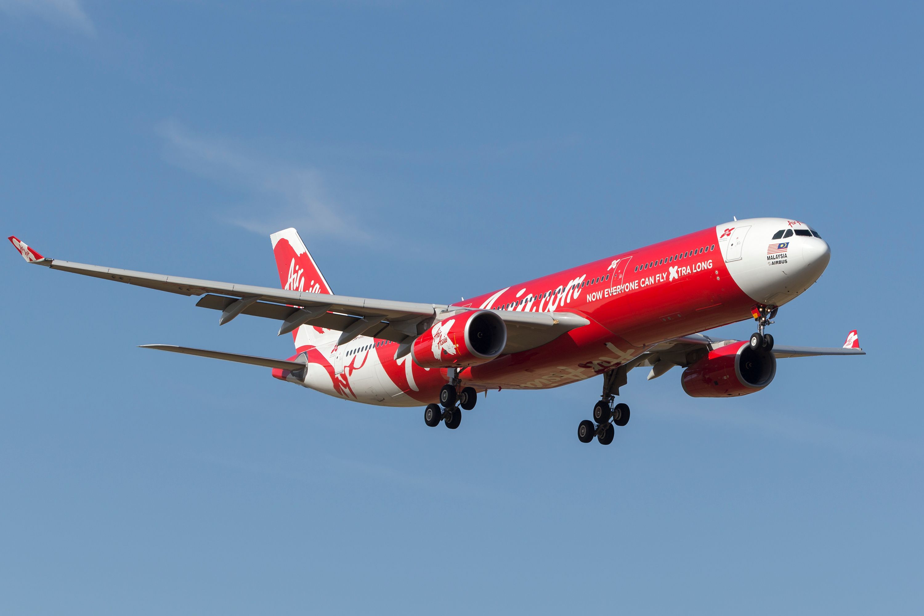 An AirAsia X Airbus A330 flying in the sky.