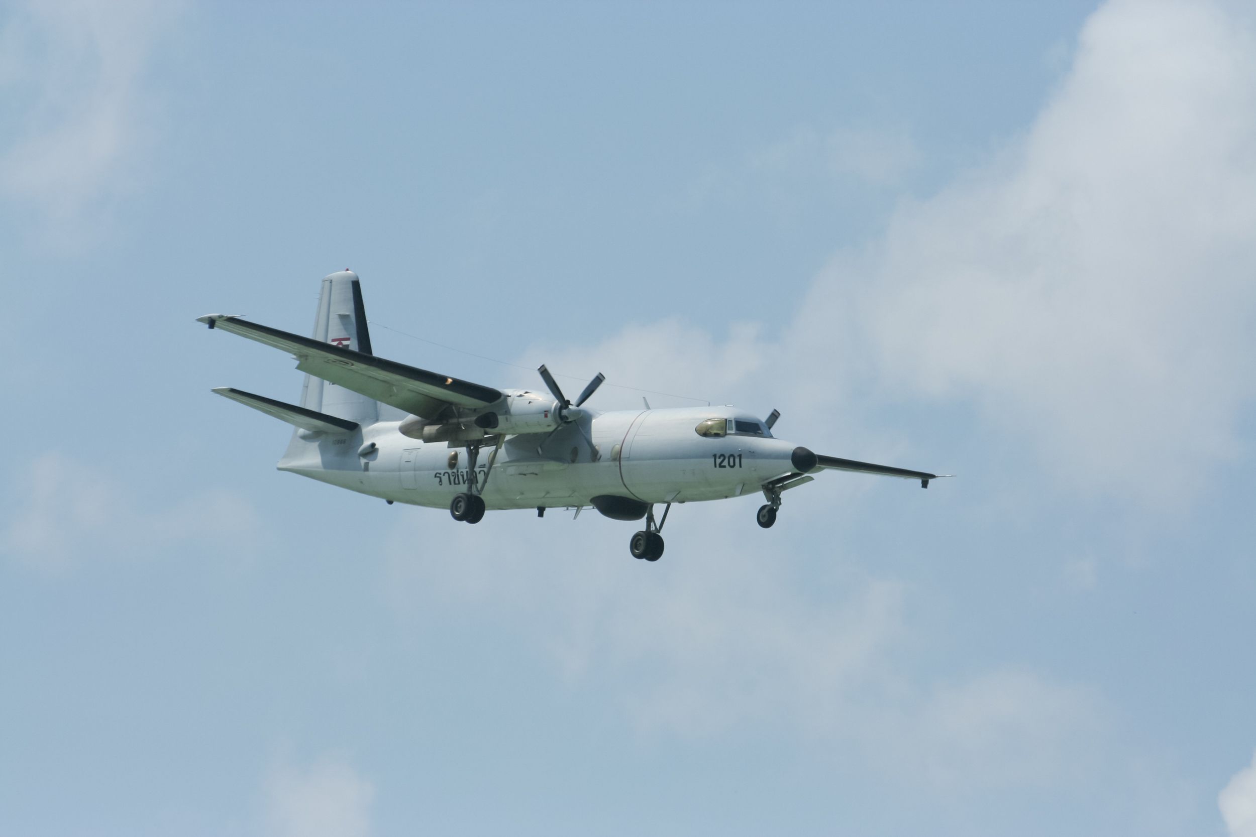 A Fokker F27 Prototype flying in the sky.