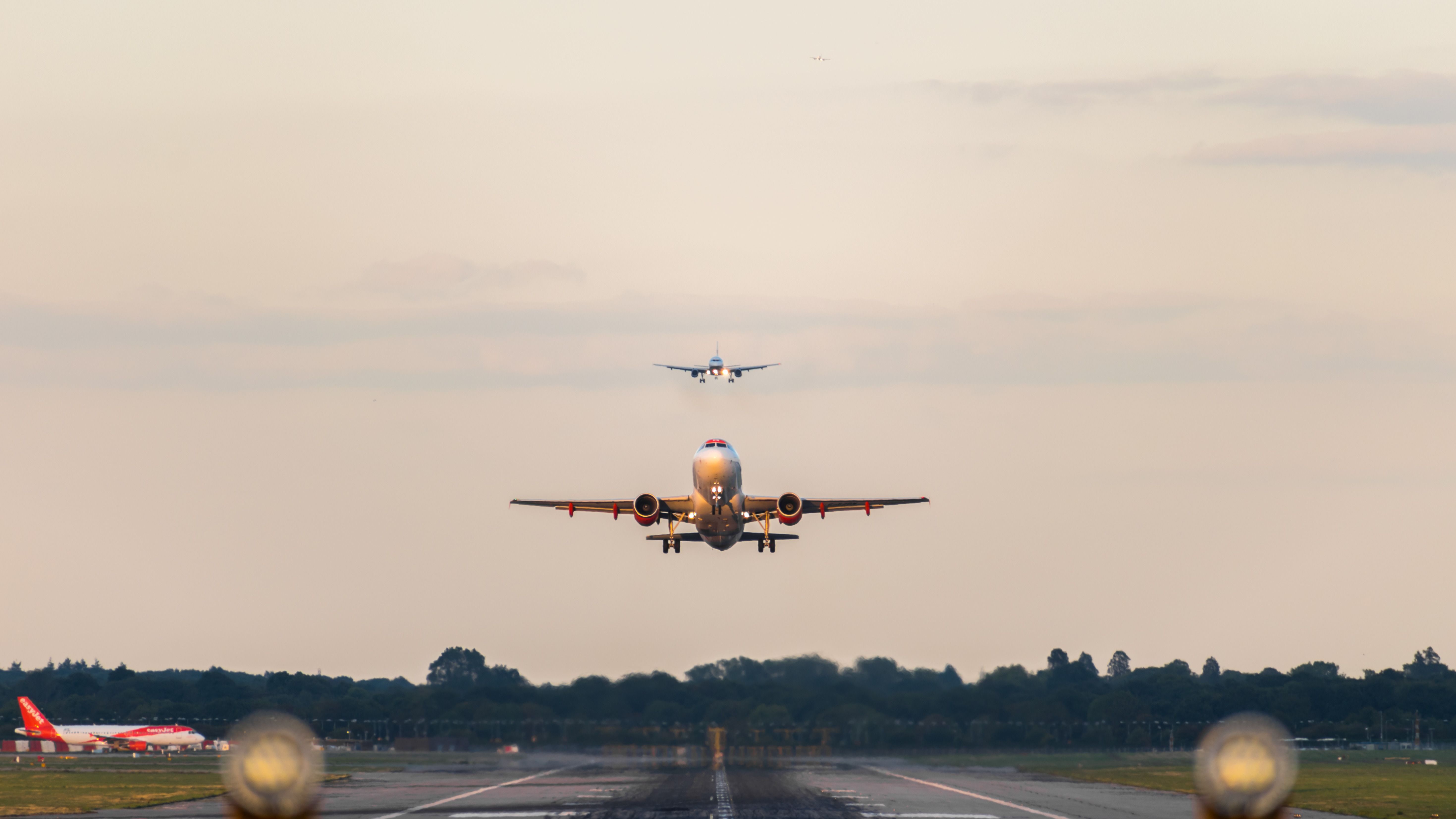Two aircraft preparing to land at Gatwick Airport