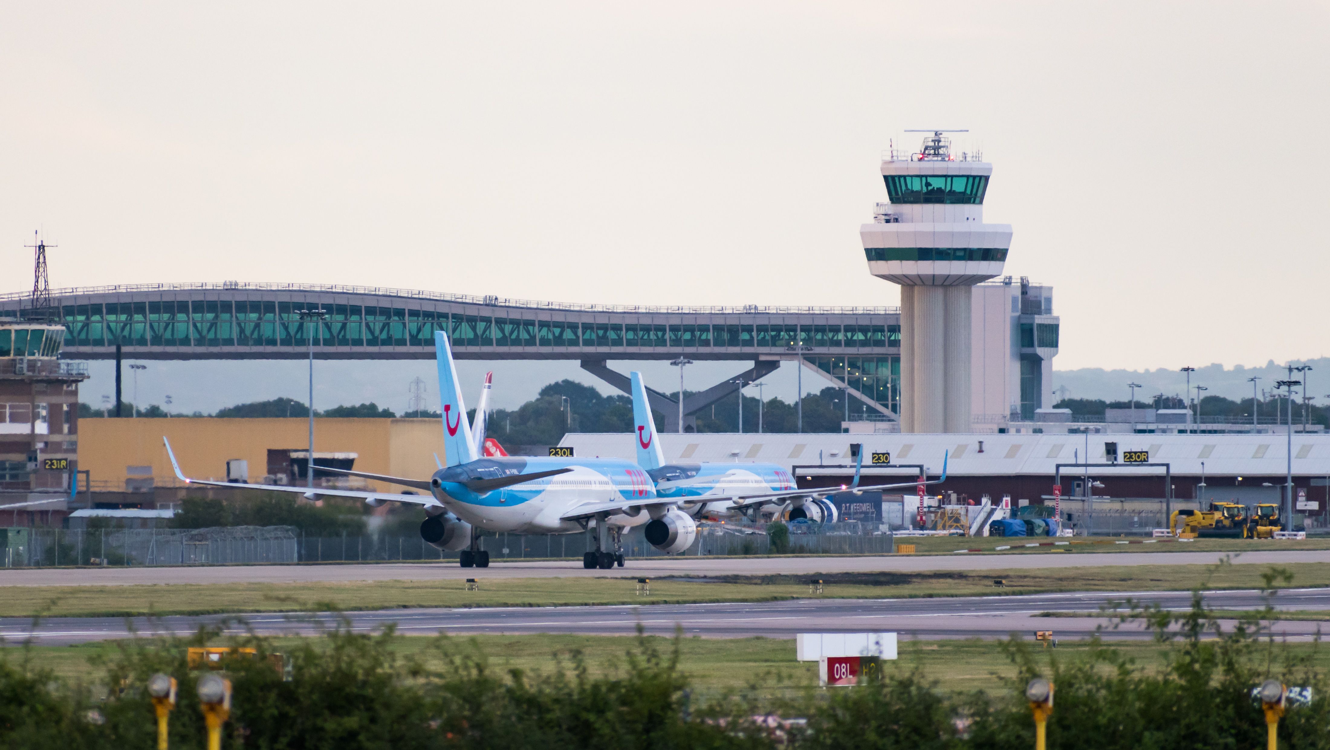 London Gatwick Airport ATC Tower With TUI Planes In Front