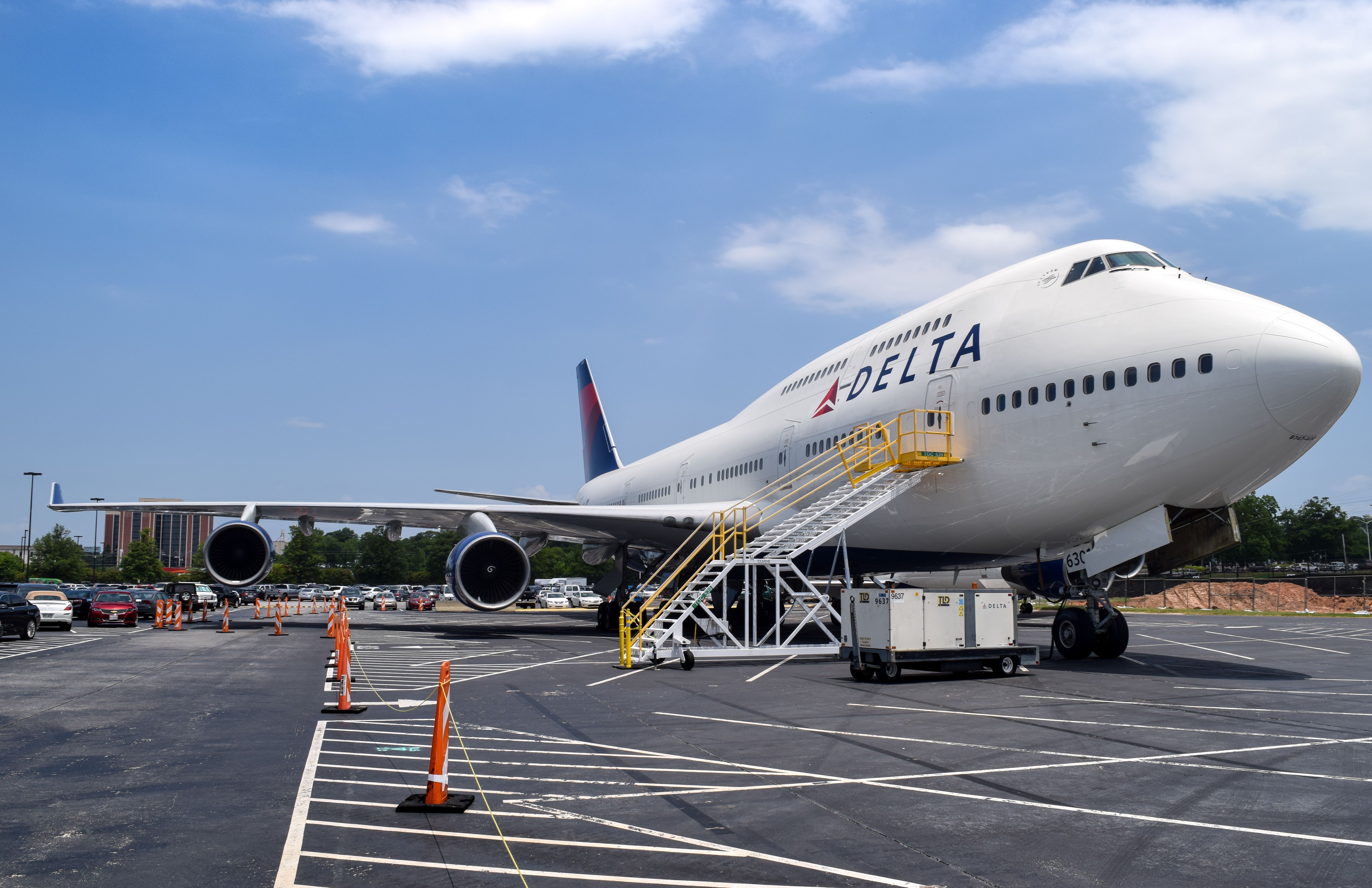 A Delta Air Lines Boeing 747-400 Parked at an airport.