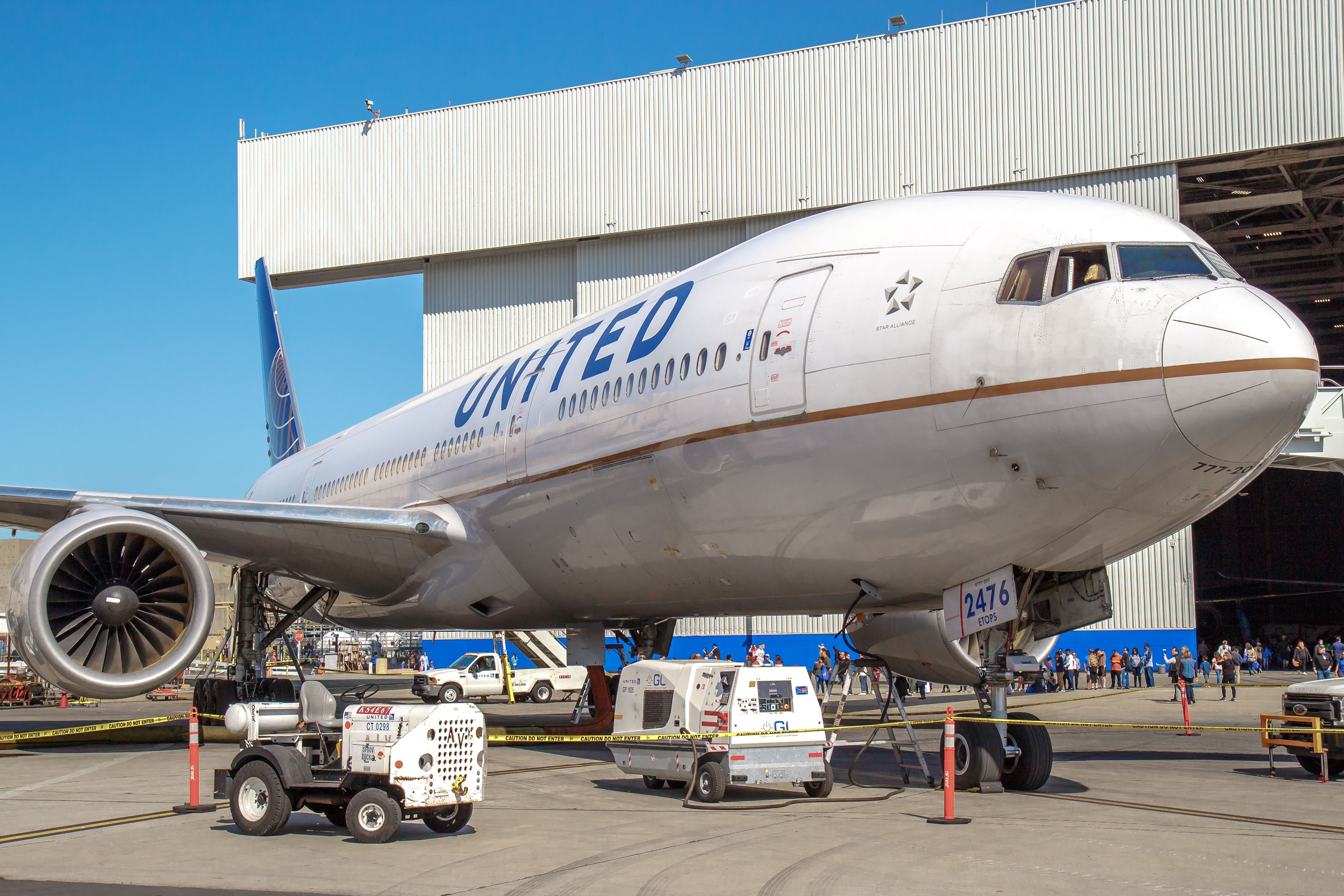 A United Airlines Boeing 777-200 parked outside of the carrier's SFO Maintenance Facility.