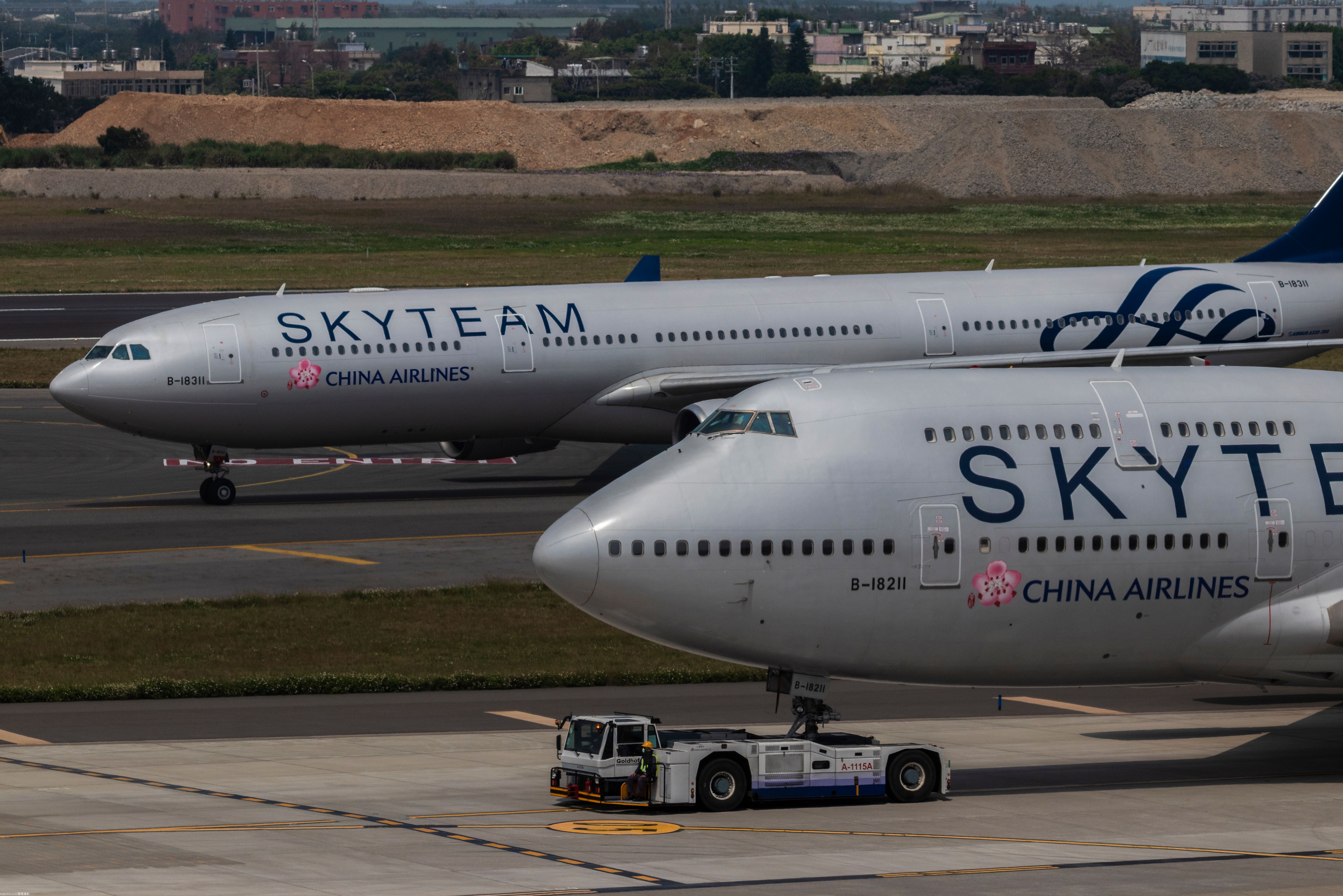Two China Airlines aircraft in Skyteam livery on an airport apron.