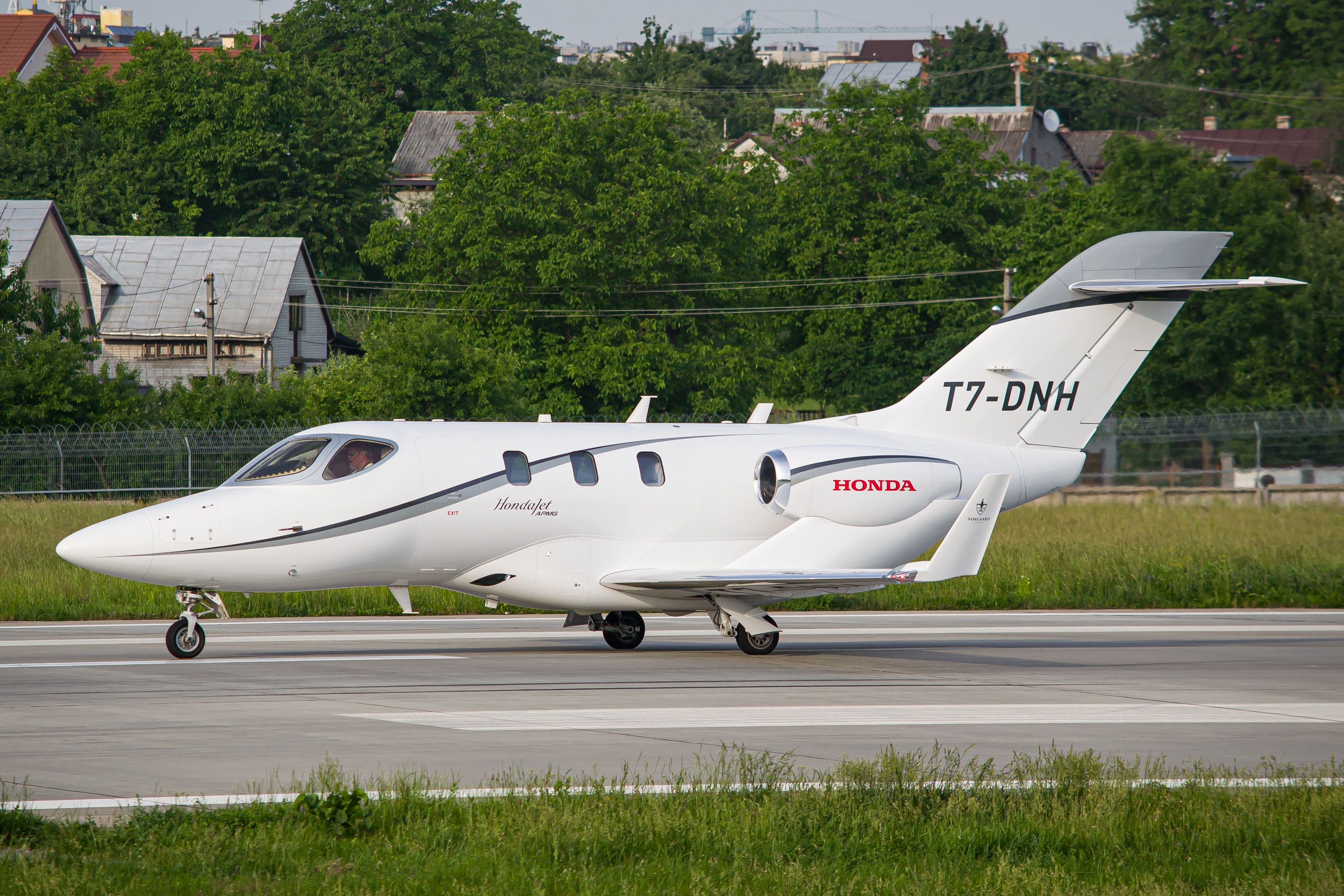 A HondaJet taxiing to the runway.