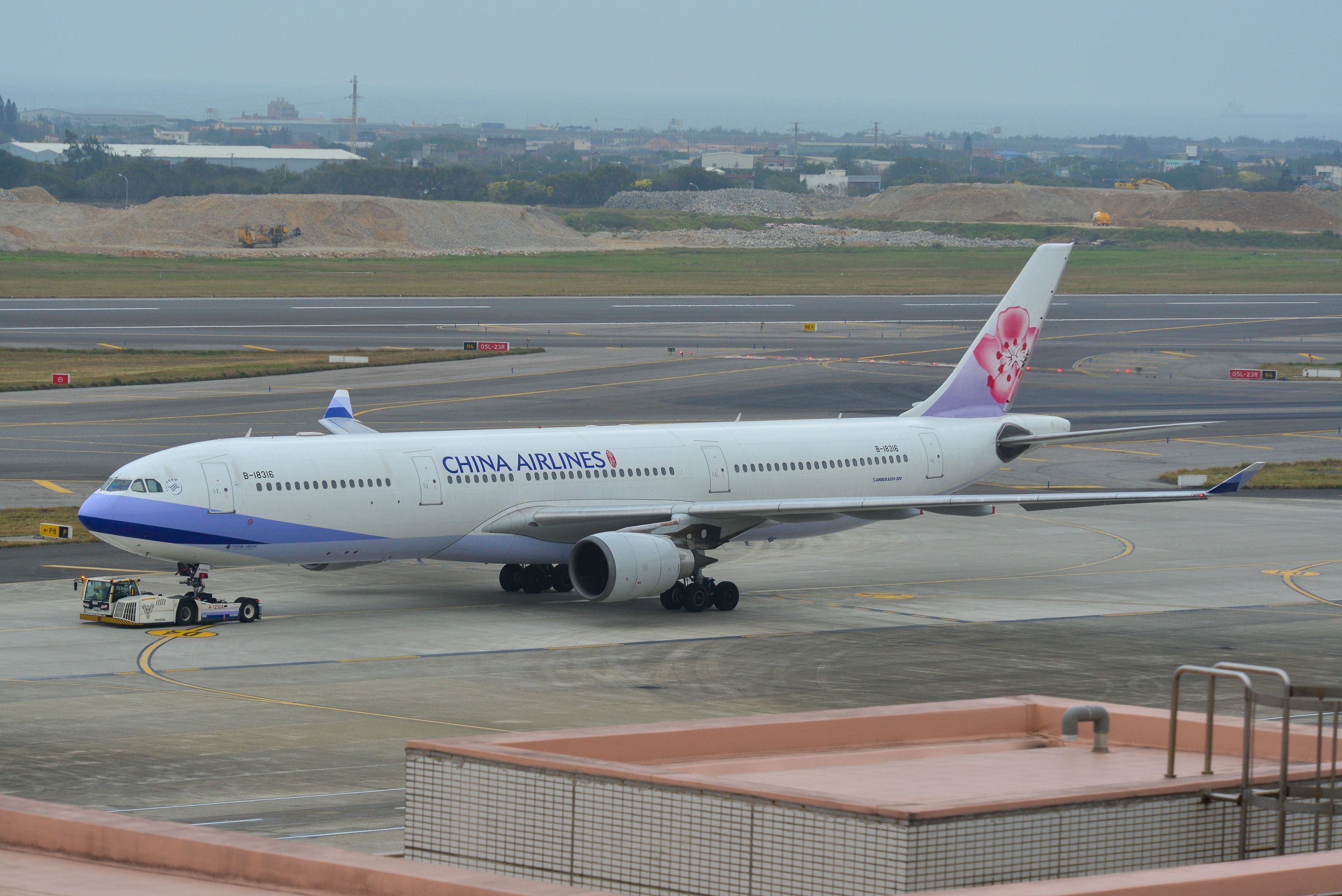 A China Airlines Airbus A330-300 being pushed back at Taoyuan Airport.