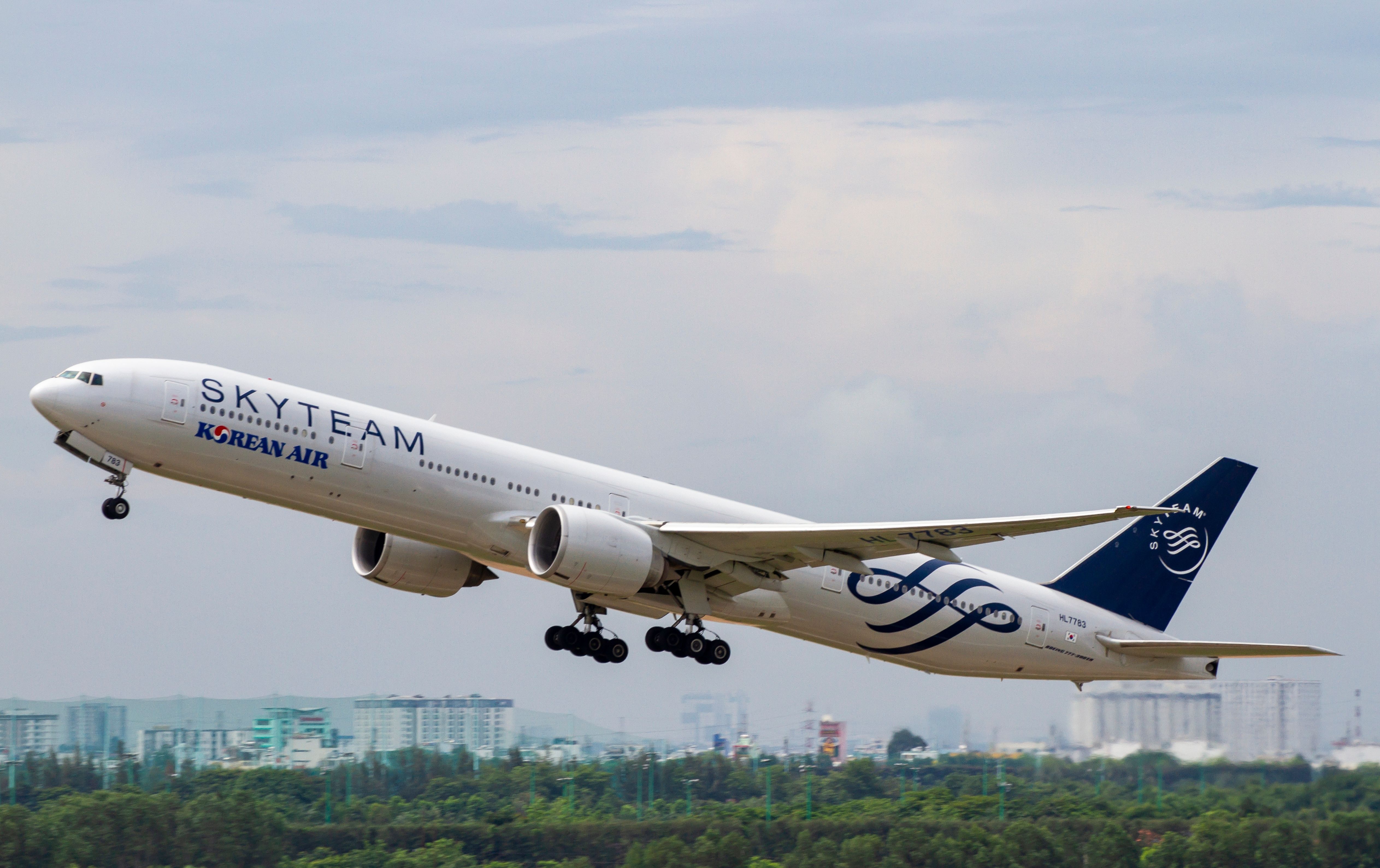 A Korean Air Boeing 777-300ER in SkyTeam livery just after take off.
