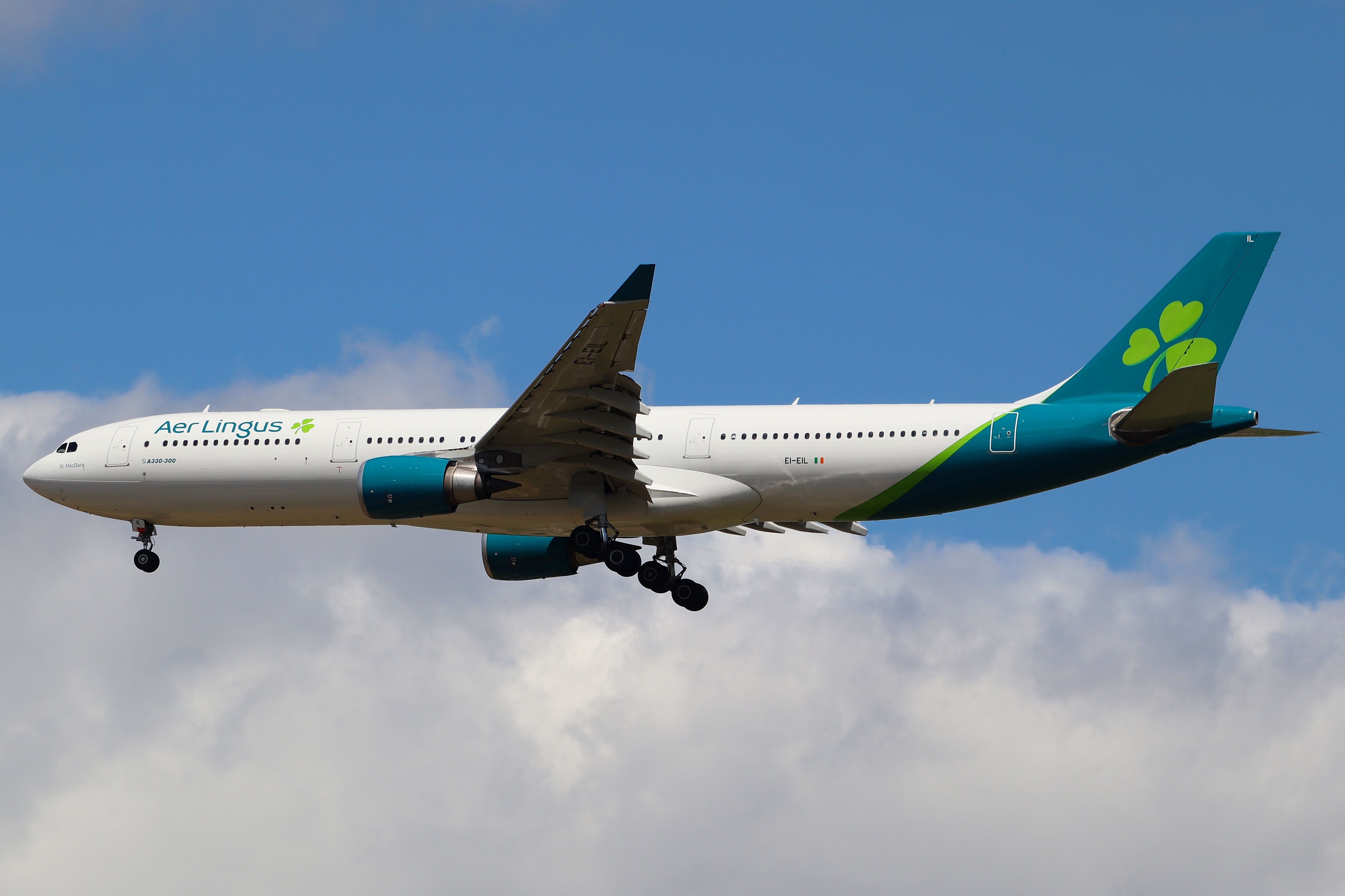 Aer Lingus Airbus A330 flying below the clouds.