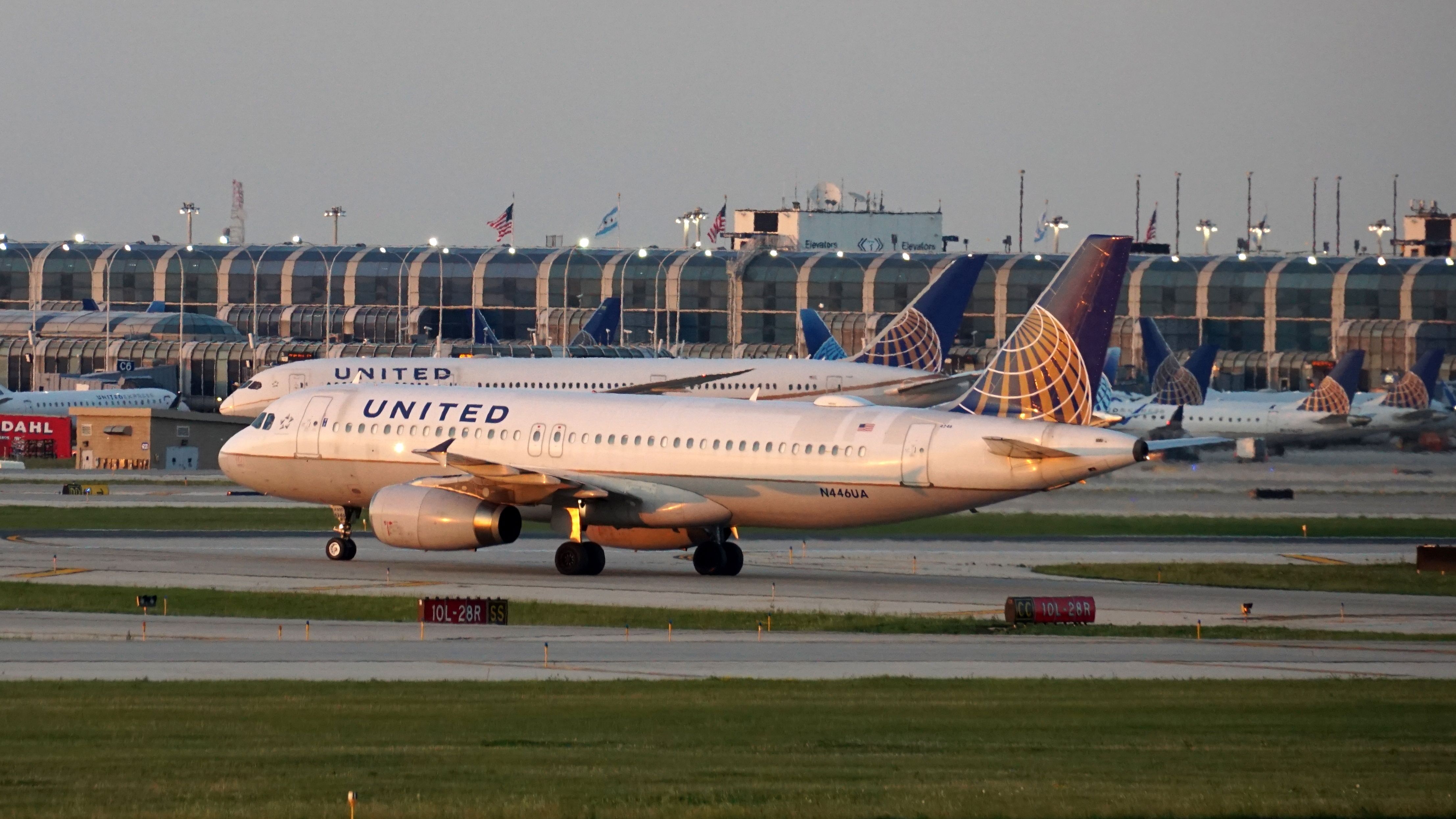 Two United Airlines aircraft on the apron at Chicago O'Hare Airport.